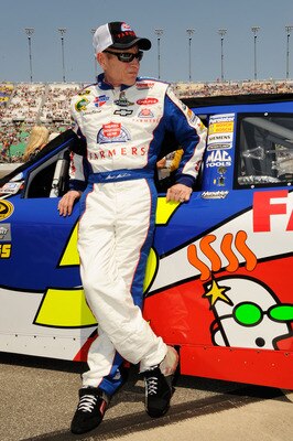 KANSAS CITY, KS - JUNE 05:  Mark Martin, driver of the #5 Farmers Insurance/GoDaddy.com Chevrolet, stands on the grid prior to the NASCAR Sprint Cup Series STP 400 at Kansas Speedway on June 5, 2011 in Kansas City, Kansas.  (Photo by John Harrelson/Getty 