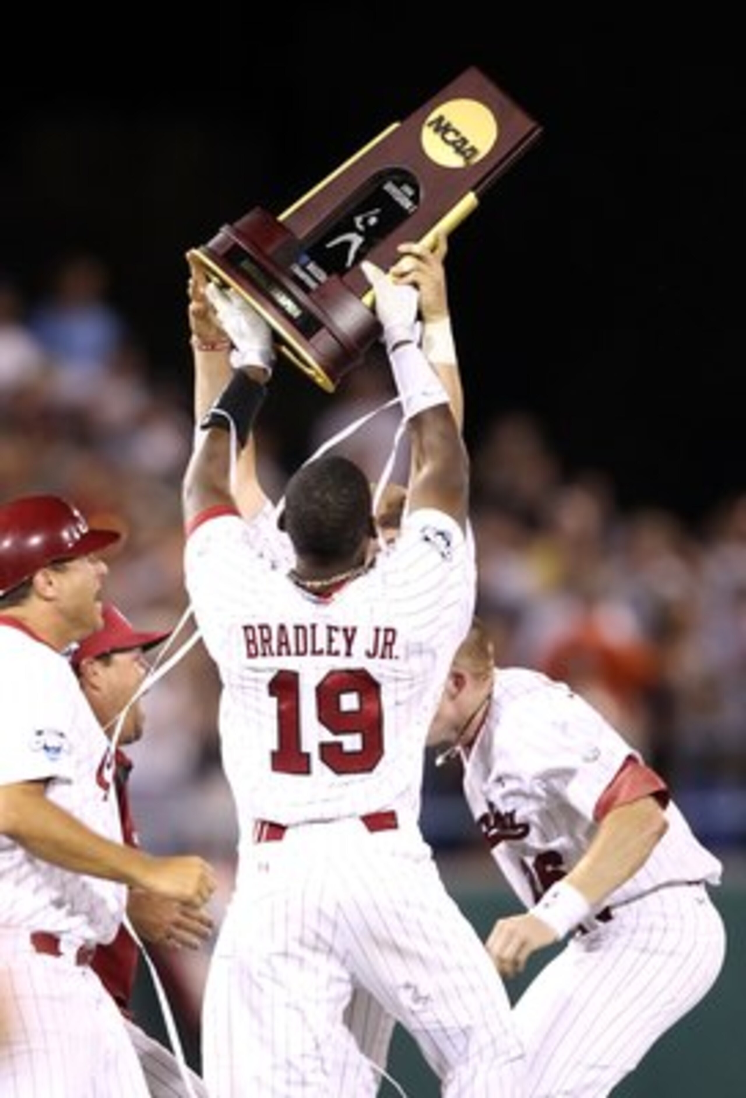 OMAHA, NE - JUNE 29:  Jackie Bradley, Jr. #19 of the South Carolina Gamecocks celebrates with the championship trophy after defeating the UCLA Bruins in game 2 of the men's 2010 NCAA College Baseball World Series at Rosenblatt Stadium on June 29, 2010 in