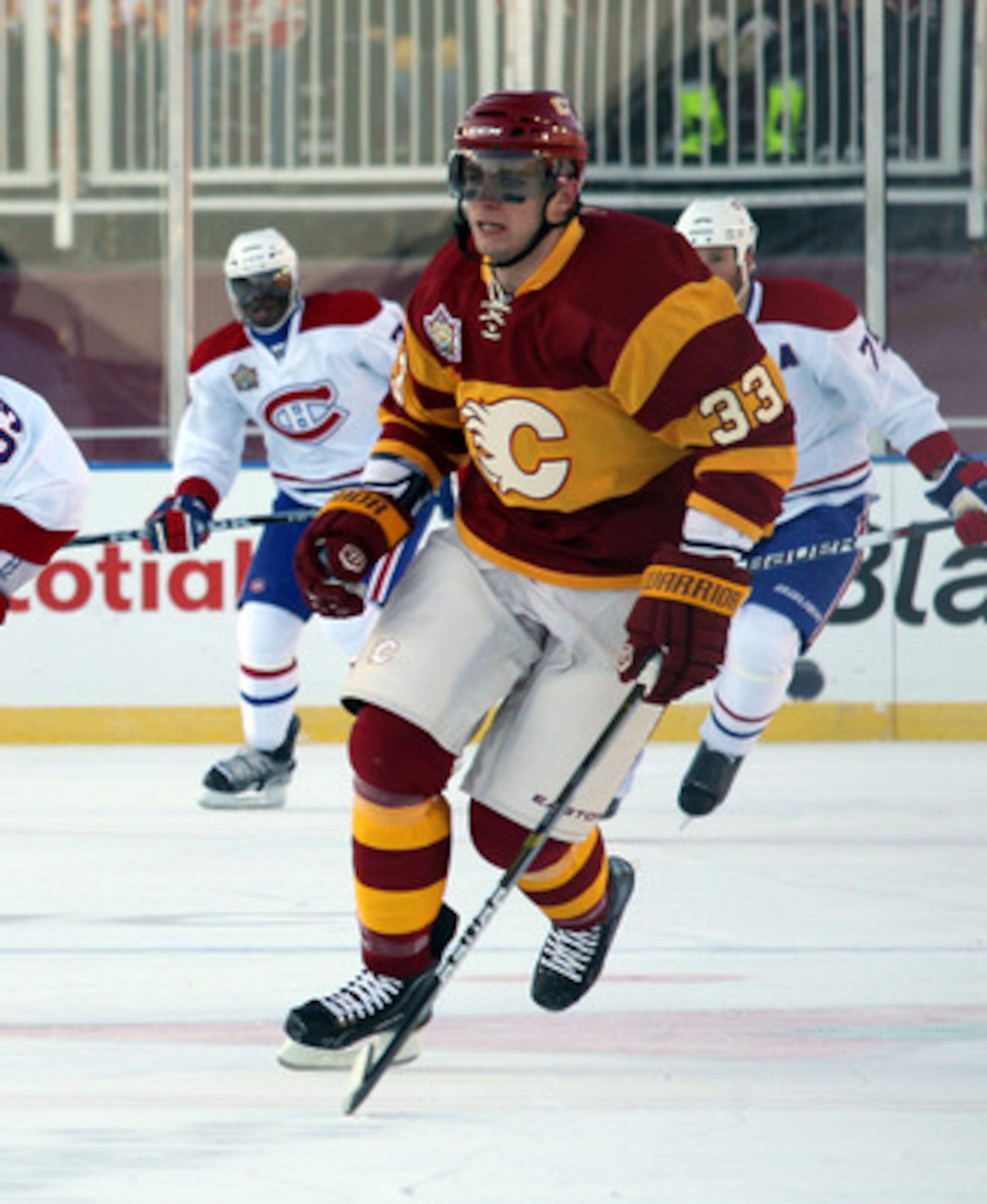 CALGARY, AB - FEBRUARY 20:  Anton Babchuk #33 of the Calgary Flames skates against the Montreal Canadiens during the 2011 NHL Heritage Classic Game at McMahon Stadium on February 20, 2011 in Calgary, Alberta, Canada. The Flames defeated the Canadiens 4-0.