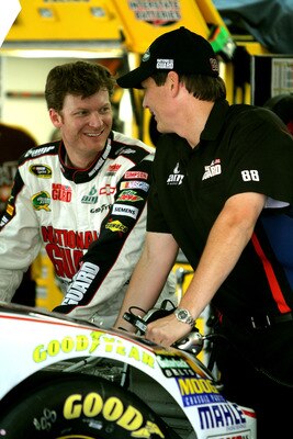 CHARLOTTE, NC - MAY 28:  Dale Earnhardt Jr. (L), driver of the #88 National Guard/Amp Energy Chevrolet, talks with crew chief Steve Letarte (R) during practice for the NASCAR Sprint Cup Series Coca-Cola 600 at Charlotte Motor Speedway on May 28, 2011 in C