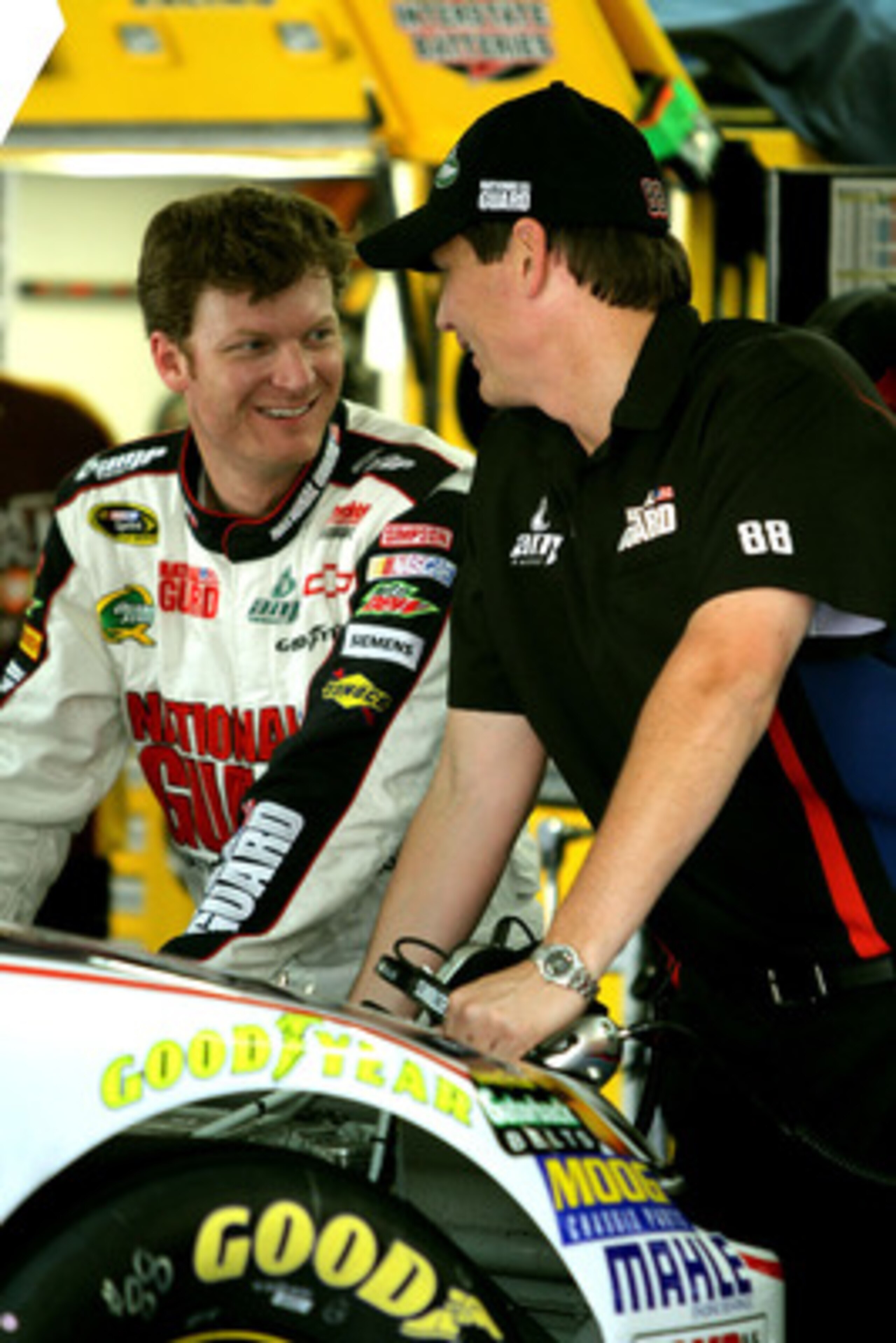 CHARLOTTE, NC - MAY 28:  Dale Earnhardt Jr. (L), driver of the #88 National Guard/Amp Energy Chevrolet, talks with crew chief Steve Letarte (R) during practice for the NASCAR Sprint Cup Series Coca-Cola 600 at Charlotte Motor Speedway on May 28, 2011 in C