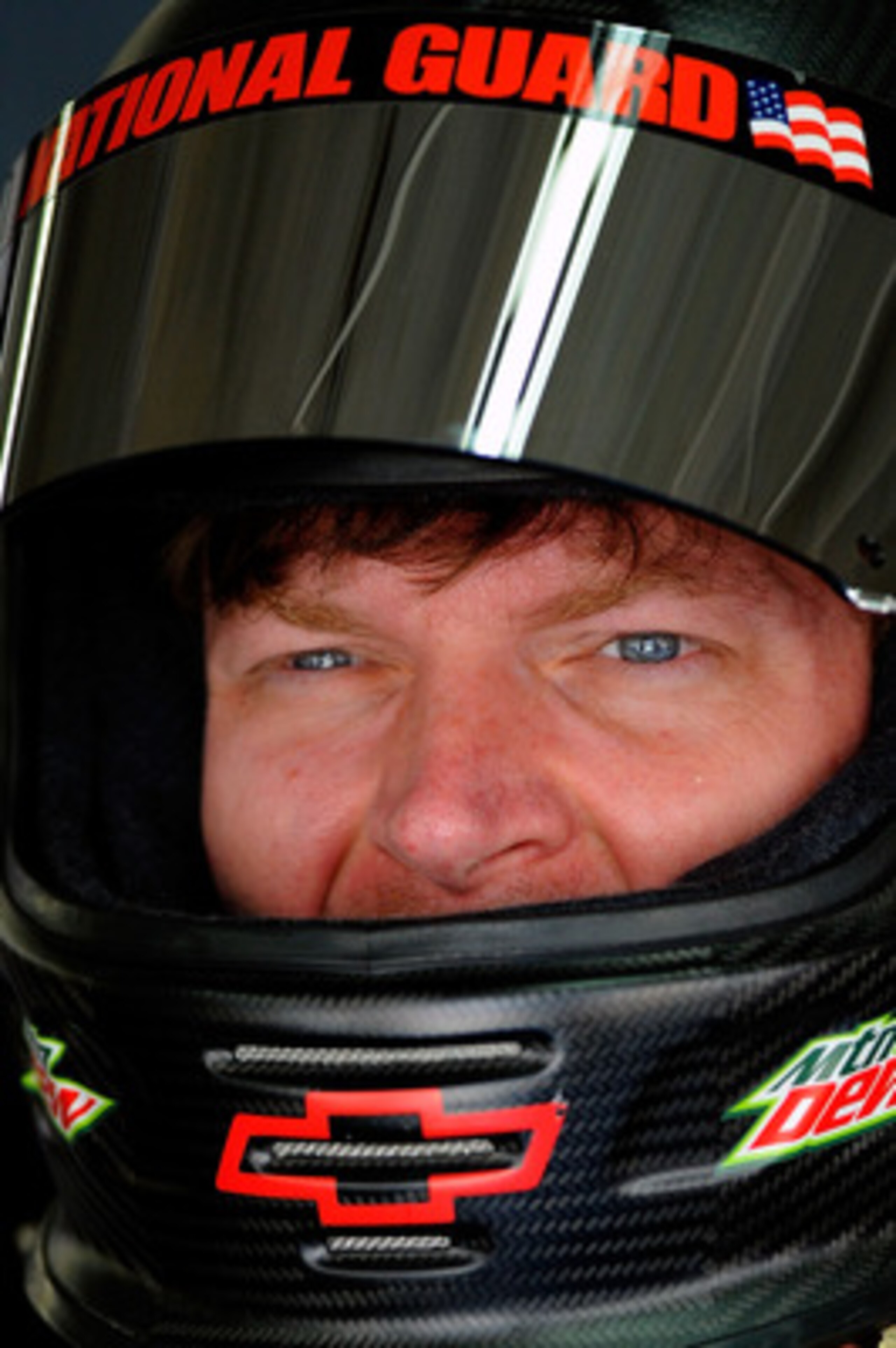 CHARLOTTE, NC - MAY 28:  Dale Earnhardt Jr., driver of the #88 National Guard/Amp Energy Chevrolet, stands in the garage during practice for the NASCAR Sprint Cup Series Coca-Cola 600 at Charlotte Motor Speedway on May 28, 2011 in Charlotte, North Carolin