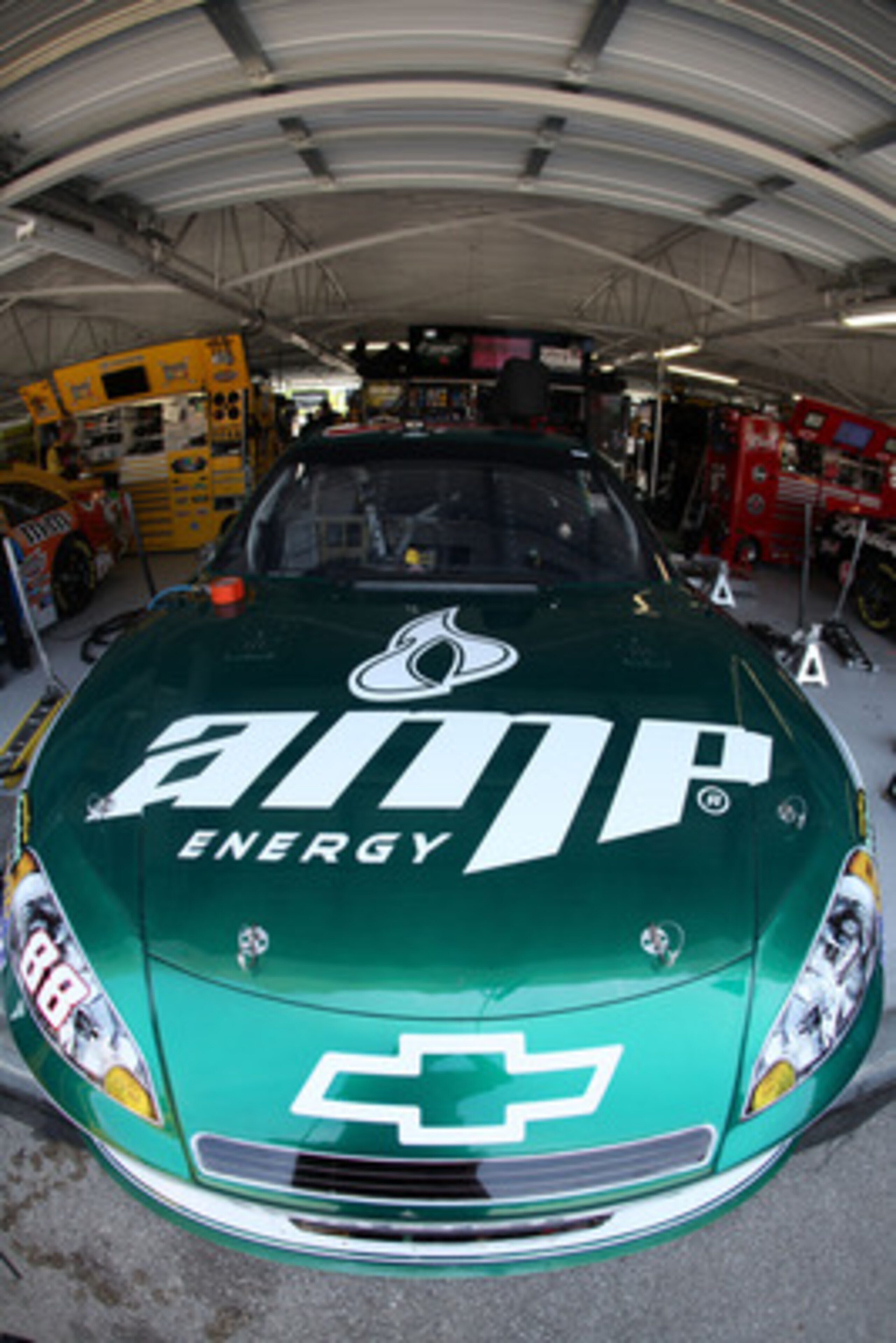 KANSAS CITY, KS - JUNE 03:  The #88 Amp Energy/National Guard Chevrolet of Dale Earnhardt Jr. sits in the garage area during practice for the NASCAR Sprint Cup Series STP 400 at Kansas Speedway on June 3, 2011 in Kansas City, Kansas.  (Photo by Jamie Squi