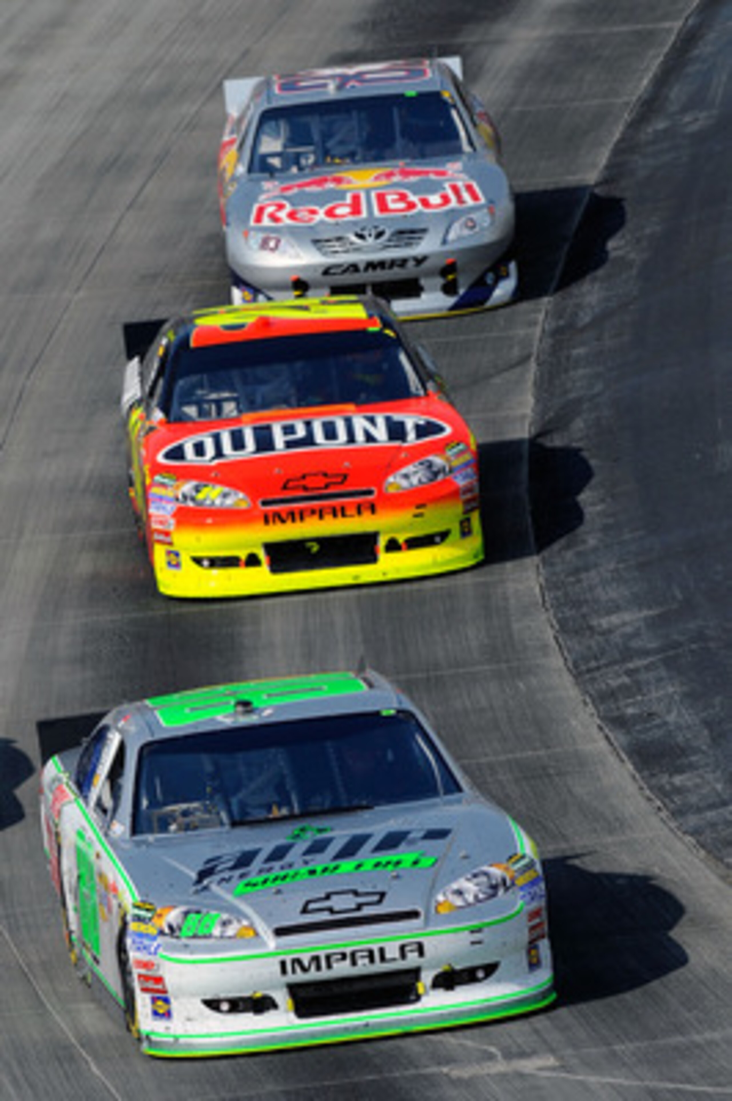DOVER, DE - MAY 15:  Dale Earnhardt Jr., driver of the #88 Amp Energy Sugar Free/National Guard Chevrolet, leads Jeff Gordon, driver of the #24 DuPont Chevrolet, and Brian Vickers, driver of the #83 Red Bull Toyota, during the NASCAR Sprint Cup Series Fed
