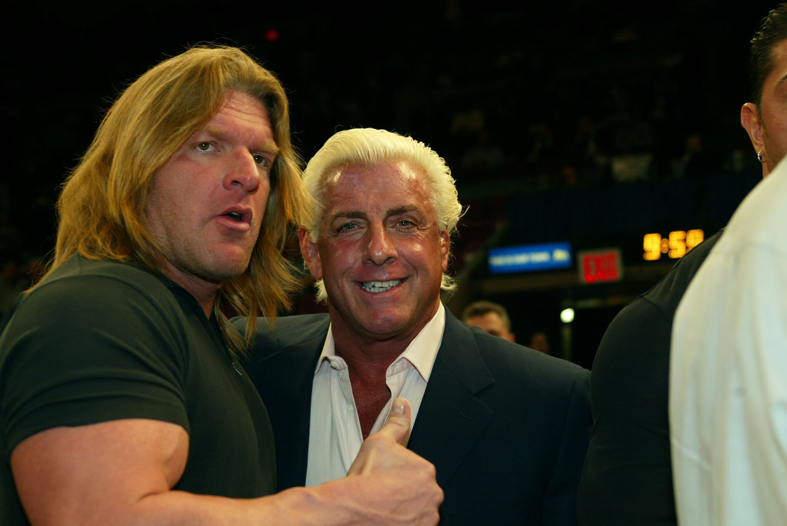 NEW YORK - MARCH 9: WWE wrestlers Triple H and Ric Flair attend the New York Knicks v Boston Celtics  NBA game March 9, 2004 at Madison Square Garden in New York City.   (Photo by Ray Amati/Getty Images)