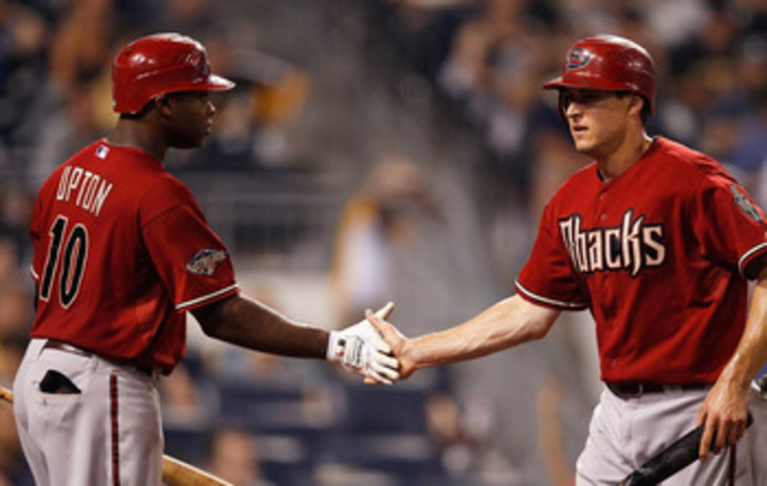 PITTSBURGH - JUNE 08:  Kelly Johnson #2 of the Arizona Diamondbacks is congratulated by teammate Justin Upton #10 after Stephen Drew #6 hit an RBI double in the tenth inning against the Pittsburgh Pirates during the game on June 8, 2011 at PNC Park in Pit