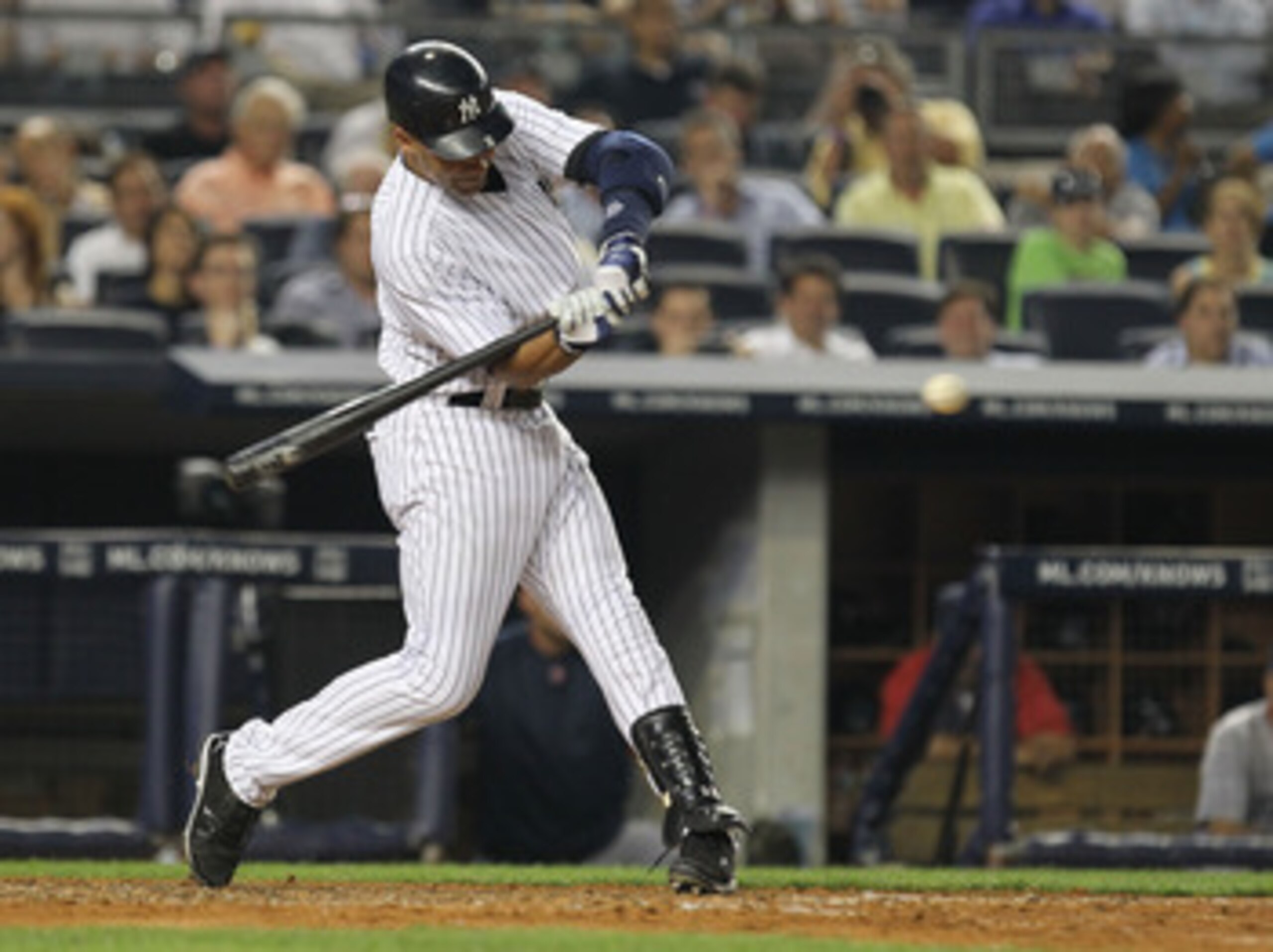 NEW YORK, NY - JUNE 07:  Derek Jeter #2 of the New York Yankees  gets a hits a against the Boston Red Sox during their game on June 7, 2011 at Yankee Stadium in the Bronx borough of New York City.  (Photo by Al Bello/Getty Images)