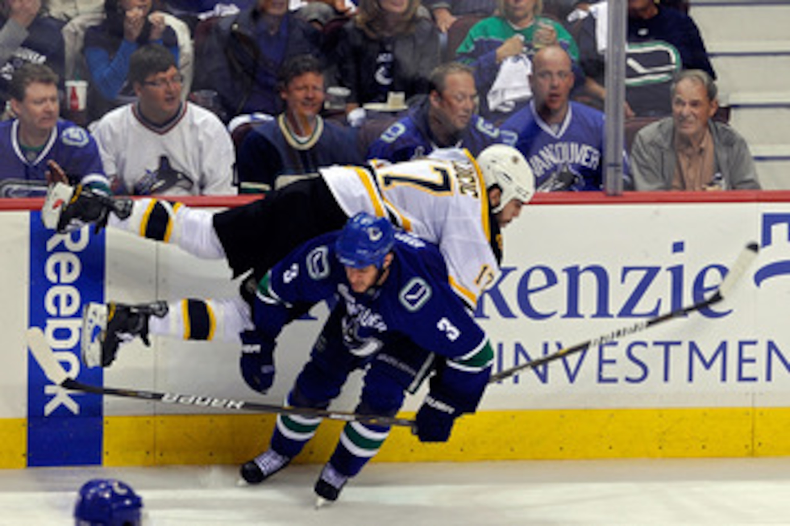 VANCOUVER, BC - JUNE 10:  Milan Lucic #17 of the Boston Bruins gets checked by Kevin Bieksa #3 of the Vancouver Canucks during Game Five of the 2011 NHL Stanley Cup Final at Rogers Arena on June 10, 2011 in Vancouver, British Columbia, Canada.  (Photo by 