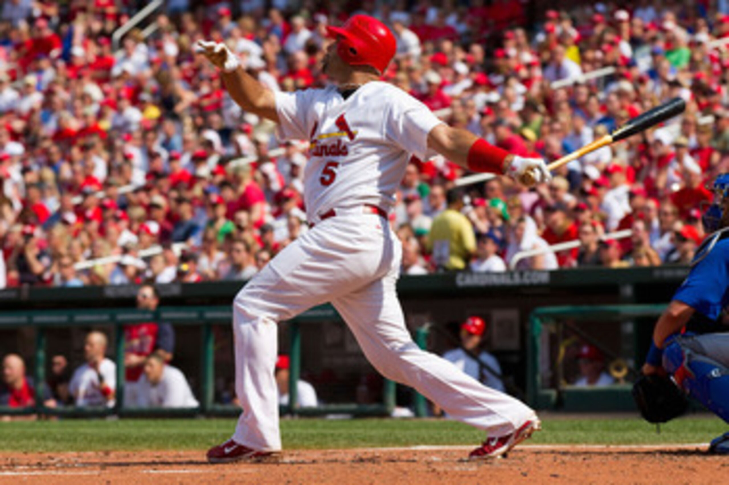 ST. LOUIS, MO - JUNE 4: Albert Pujols #5 of the St. Louis Cardinals hits a two-run home run against the Chicago Cubs at Busch Stadium on June 4, 2011 in St. Louis, Missouri.  The Cardinals beat the Cubs 5-4 in 12 innings.  (Photo by Dilip Vishwanat/Getty 
