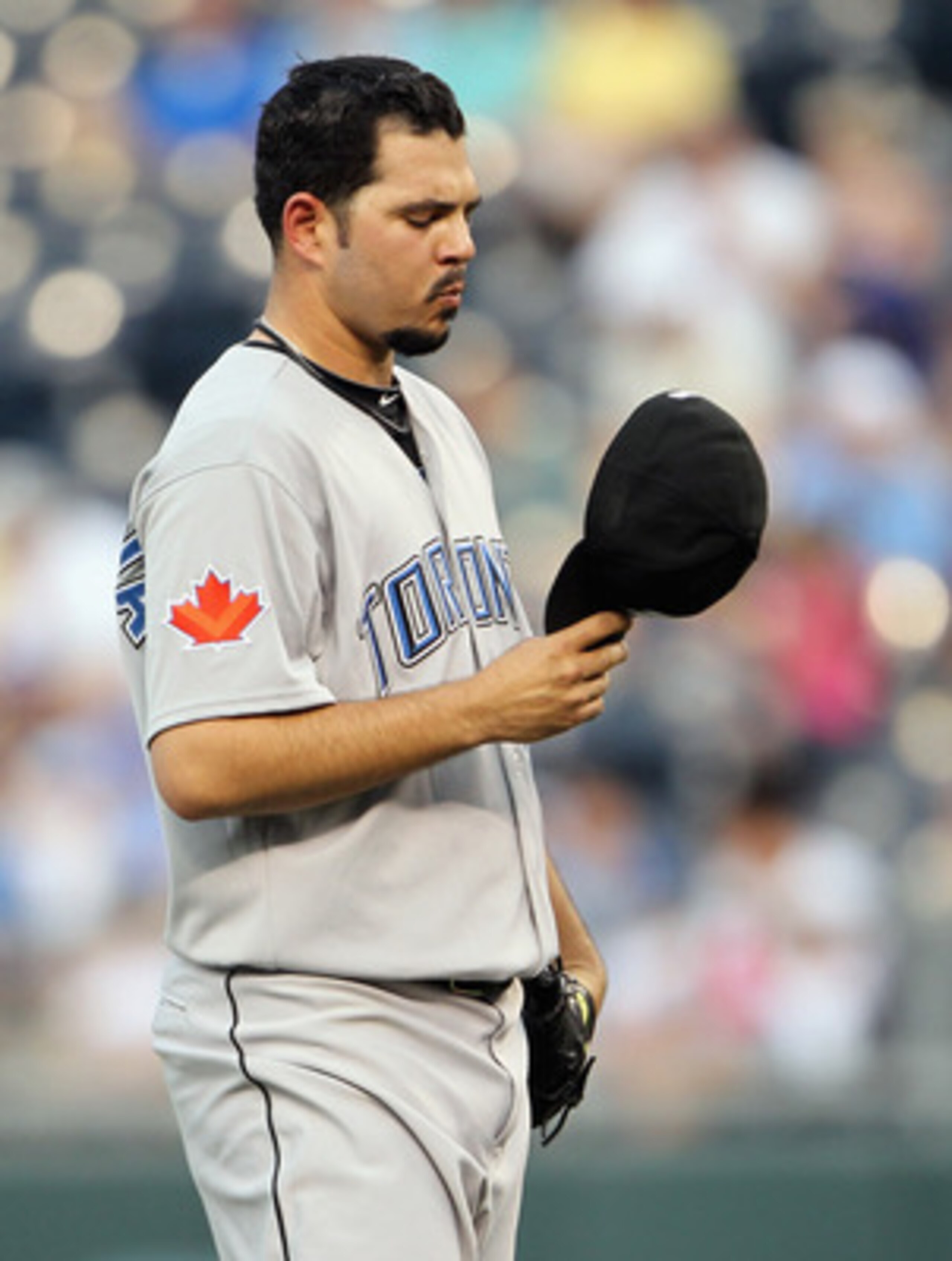 KANSAS CITY, MO - JUNE 08: Starting pitcher Carlos Villanueva #33 of the Toronto Blue Jays reacts after giving up a three-run home run to Melky Cabrera #53 in the 3rd inning of the game against the Kansas City Royals on June 8, 2011 at Kauffman Stadium i KANSAS CITY, MO - JUNE 08: Starting pitcher Carlos Villanueva #33 of the Toronto Blue Jays reacts after giving up a three-run home run to Melky Cabrera #53 in the 3rd inning of the game against the Kansas City Royals on June 8, 2011 at Kauffman Stadium i
