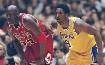 1 Feb 1998:  Guard Michael Jordan of the Chicago Bulls (left) and guard Kobe Bryant of the Los Angeles Lakers look on during a game at the Great Western Forum in Inglewood, California.  The Lakers won the game, 112-87. Mandatory Credit: Jed Jacobsohn  /Al