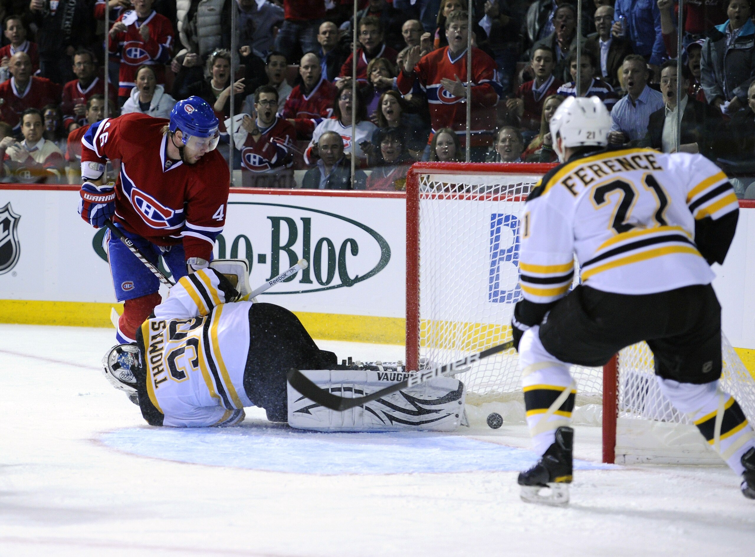 MONTREAL, QC - APRIL 21:  Andrei Kostitsyn #46 of the Montreal Canadiens stuffs the puck past a sprawling Tim Thomas #30 of the Boston Bruins in Game Four of the Eastern Conference Quarterfinals during the 2011 NHL Stanley Cup Playoffs at the Bell Centre