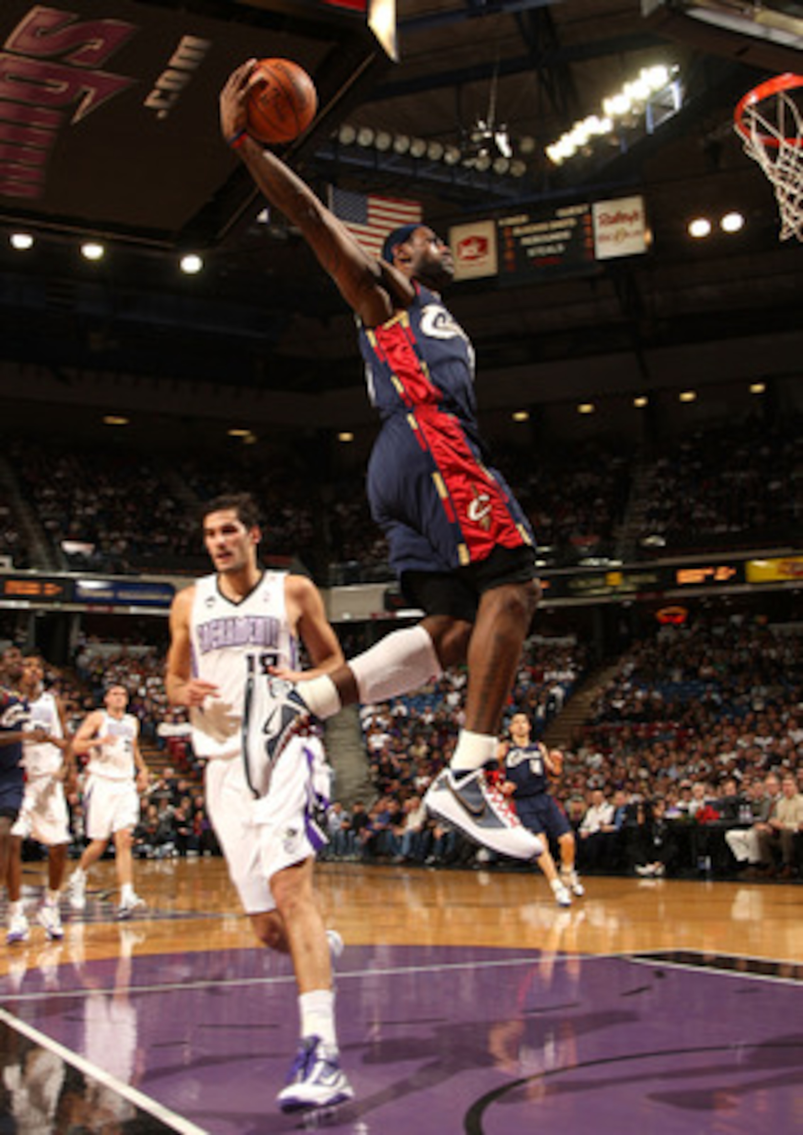 SACRAMENTO, CA - DECEMBER 23: LeBron James #23 of the Cleveland Cavaliers dunks over Omri Casspi #18 of the Sacramento Kings during an NBA game at ARCO Arena on December 23, 2009 in Sacramento, California.  NOTE TO USER: User expressly acknowledges and ag