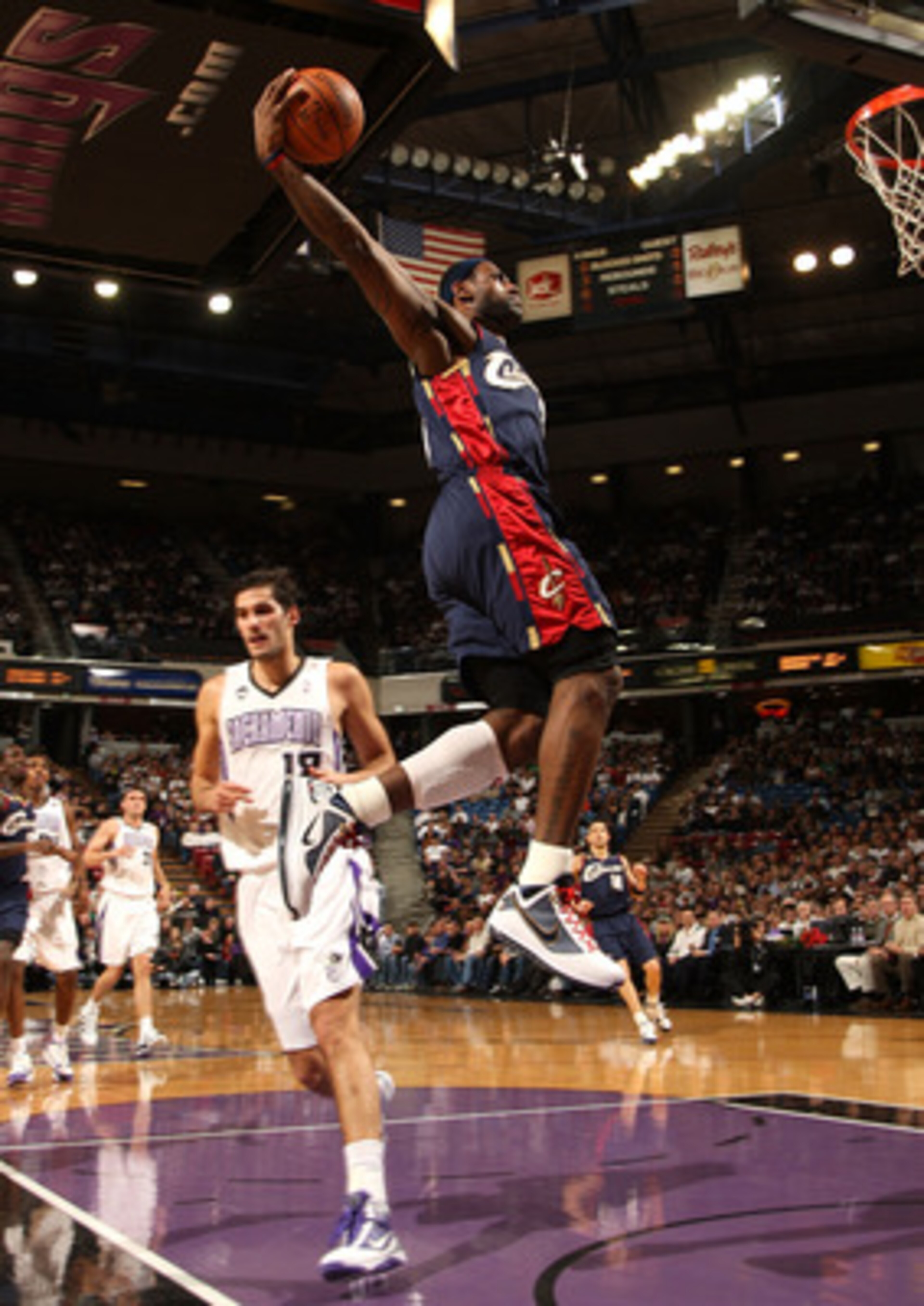 SACRAMENTO, CA - DECEMBER 23: LeBron James #23 of the Cleveland Cavaliers dunks over Omri Casspi #18 of the Sacramento Kings during an NBA game at ARCO Arena on December 23, 2009 in Sacramento, California.  NOTE TO USER: User expressly acknowledges and ag