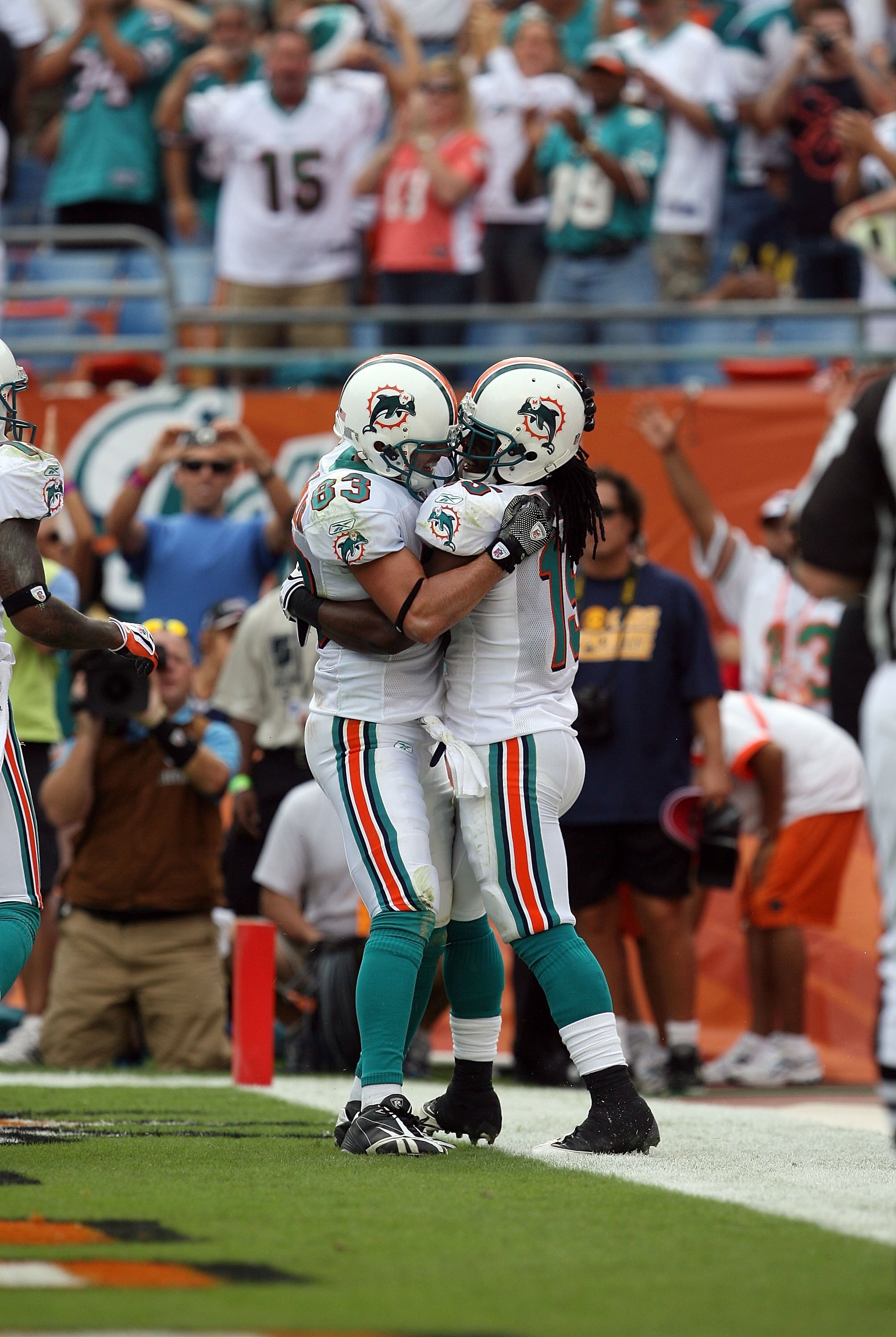 MIAMI - DECEMBER 06:  Wide receiver Davone Bess #15 and offensive lineman Andrew Gardner #63 of the Miami Dolphins celebrate after Bess' touchdown catch against the New England Patriots at Land Shark Stadium on December 6, 2009 in Miami, Florida. The Dolp
