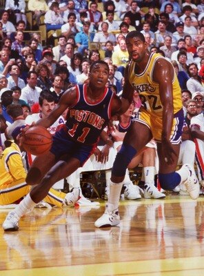 1987:  ISIAH THOMAS OF THE DETROIT PISTONS DRIVES PAST MAGIC JOHNSON OF THE LAKERS. Mandatory Credit: Rick Stewart/ALLSPORT
