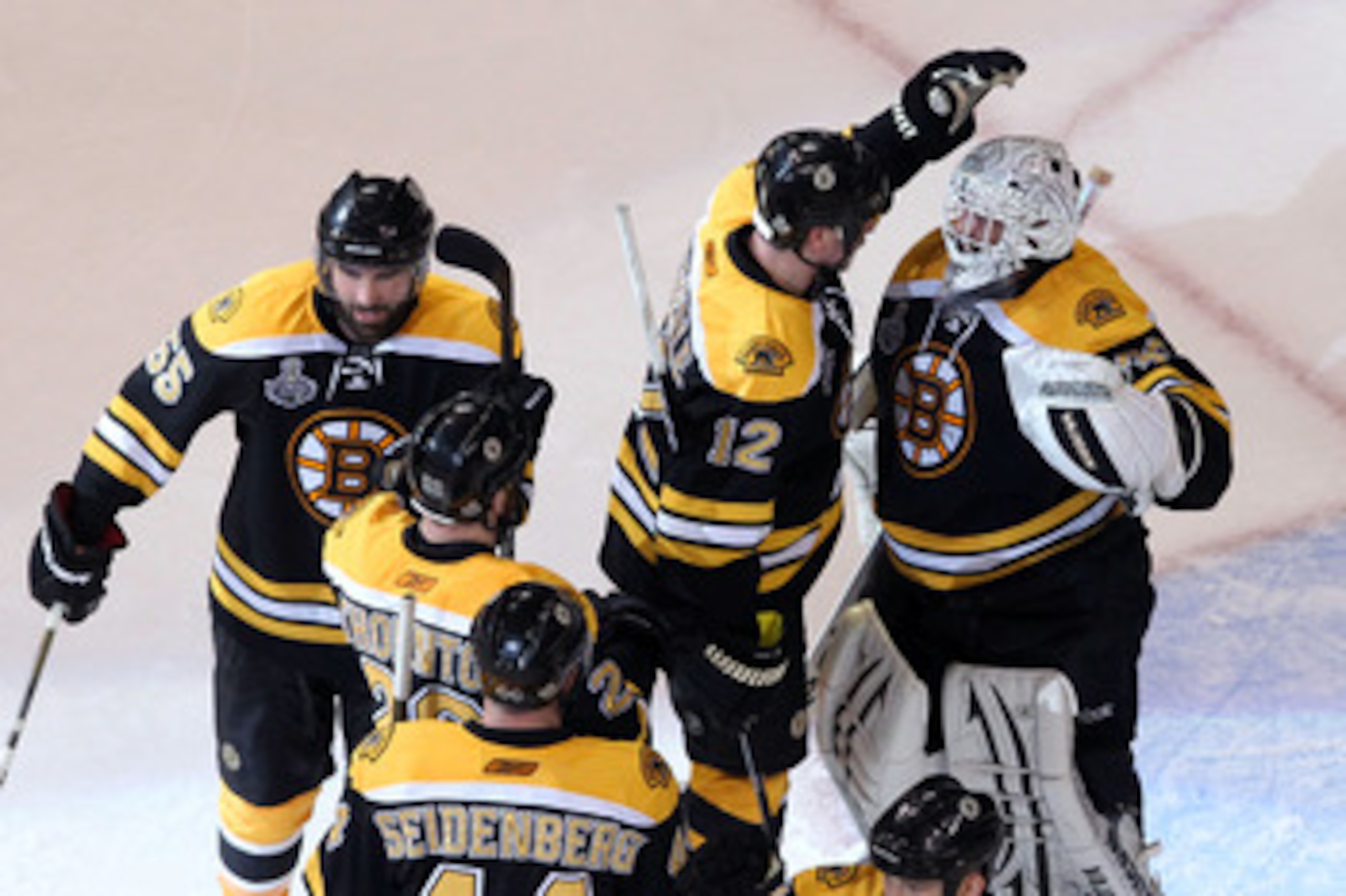 BOSTON, MA - JUNE 08: Tim Thomas #30 of the Boston Bruins celebrates with his teammates Dennis Seidenberg #44, Johnny Boychuk #55 and Tomas Kaberle #12 after defeating the Vancouver Canucks in Game Four of the 2011 NHL Stanley Cup Final at TD Garden on J BOSTON, MA - JUNE 08: Tim Thomas #30 of the Boston Bruins celebrates with his teammates Dennis Seidenberg #44, Johnny Boychuk #55 and Tomas Kaberle #12 after defeating the Vancouver Canucks in Game Four of the 2011 NHL Stanley Cup Final at TD Garden on J