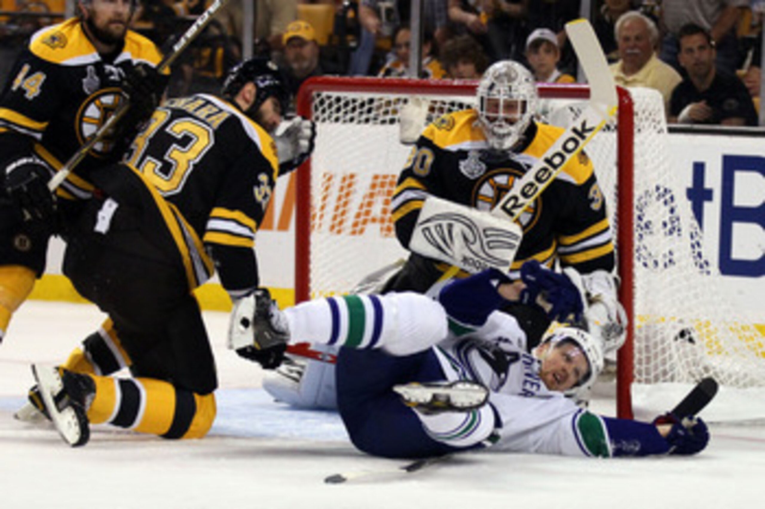 BOSTON, MA - JUNE 08: Henrik Sedin #33 of the Vancouver Canucks falls over Zdeno Chara #33 of the Boston Bruins during Game Four of the 2011 NHL Stanley Cup Final at TD Garden on June 8, 2011 in Boston, Massachusetts. (Photo by Elsa/Getty Images) BOSTON, MA - JUNE 08: Henrik Sedin #33 of the Vancouver Canucks falls over Zdeno Chara #33 of the Boston Bruins during Game Four of the 2011 NHL Stanley Cup Final at TD Garden on June 8, 2011 in Boston, Massachusetts. (Photo by Elsa/Getty Images)