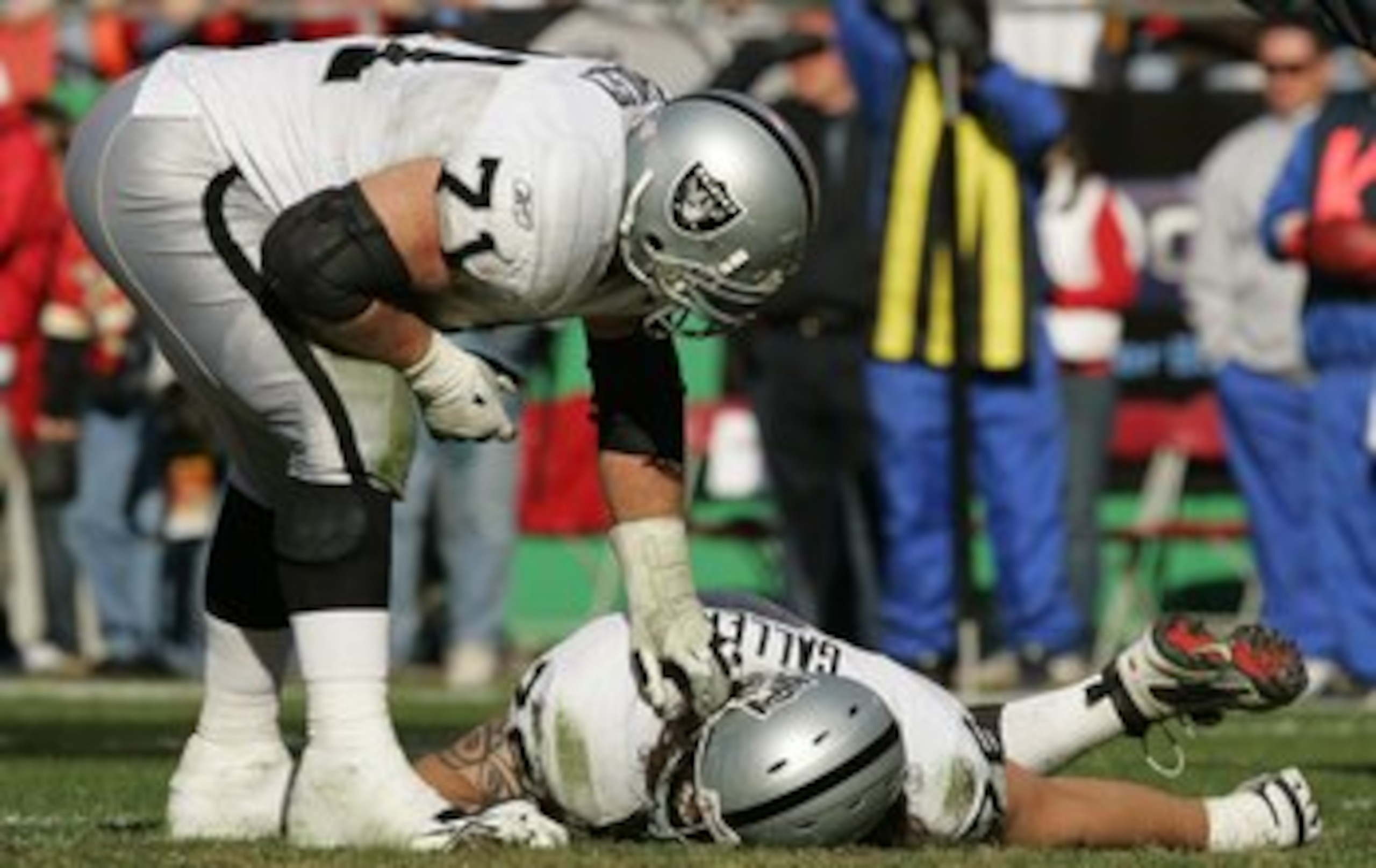 KANSAS CITY, MO - NOVEMBER 19:  Offensive guard Corey Hulsey #71 of the Oakland Raiders stands over tackle Robert Gallery after Gallery was injured against the Kansas City Chiefs on November 19, 2006 at Arrowhead Stadium in Kansas City, Missouri.  The Chi