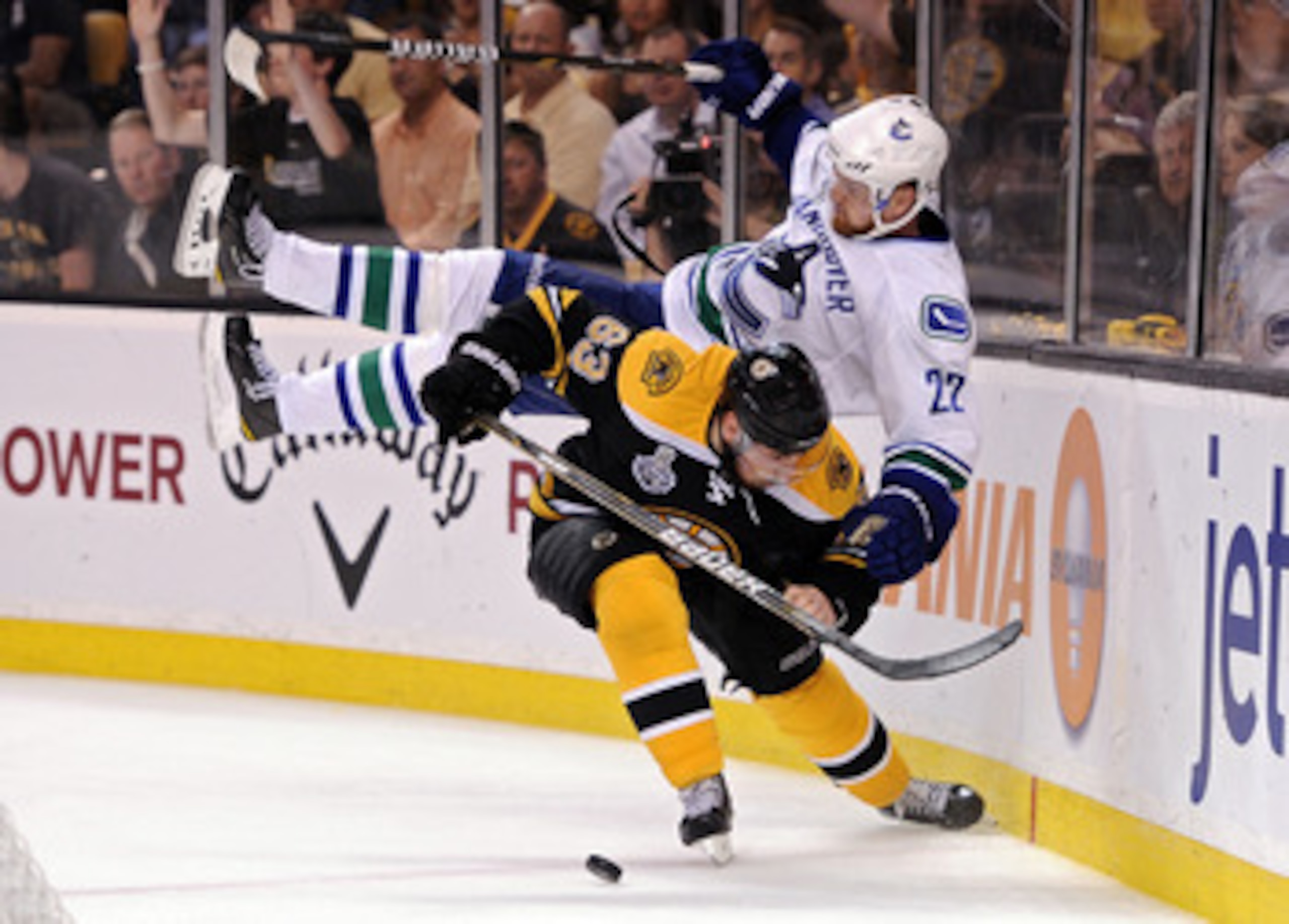 BOSTON, MA - JUNE 08: Brad Marchand #63 of the Boston Bruins dodges Daniel Sedin #22 of the Vancouver Canucks during Game Four of the 2011 NHL Stanley Cup Final at TD Garden on June 8, 2011 in Boston, Massachusetts. (Photo by Harry How/Getty Images) BOSTON, MA - JUNE 08: Brad Marchand #63 of the Boston Bruins dodges Daniel Sedin #22 of the Vancouver Canucks during Game Four of the 2011 NHL Stanley Cup Final at TD Garden on June 8, 2011 in Boston, Massachusetts. (Photo by Harry How/Getty Images)
