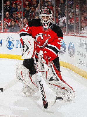 NEWARK, NJ - MARCH 12:  Goaltender Martin Brodeur #30 of the New Jersey Devils clears the puck behind the net against the New York Islanders on March 12, 2011 at the Prudential Center in Newark, New Jersey. Devisl defeated the Islanders 3-2 in OT. (Photo 
