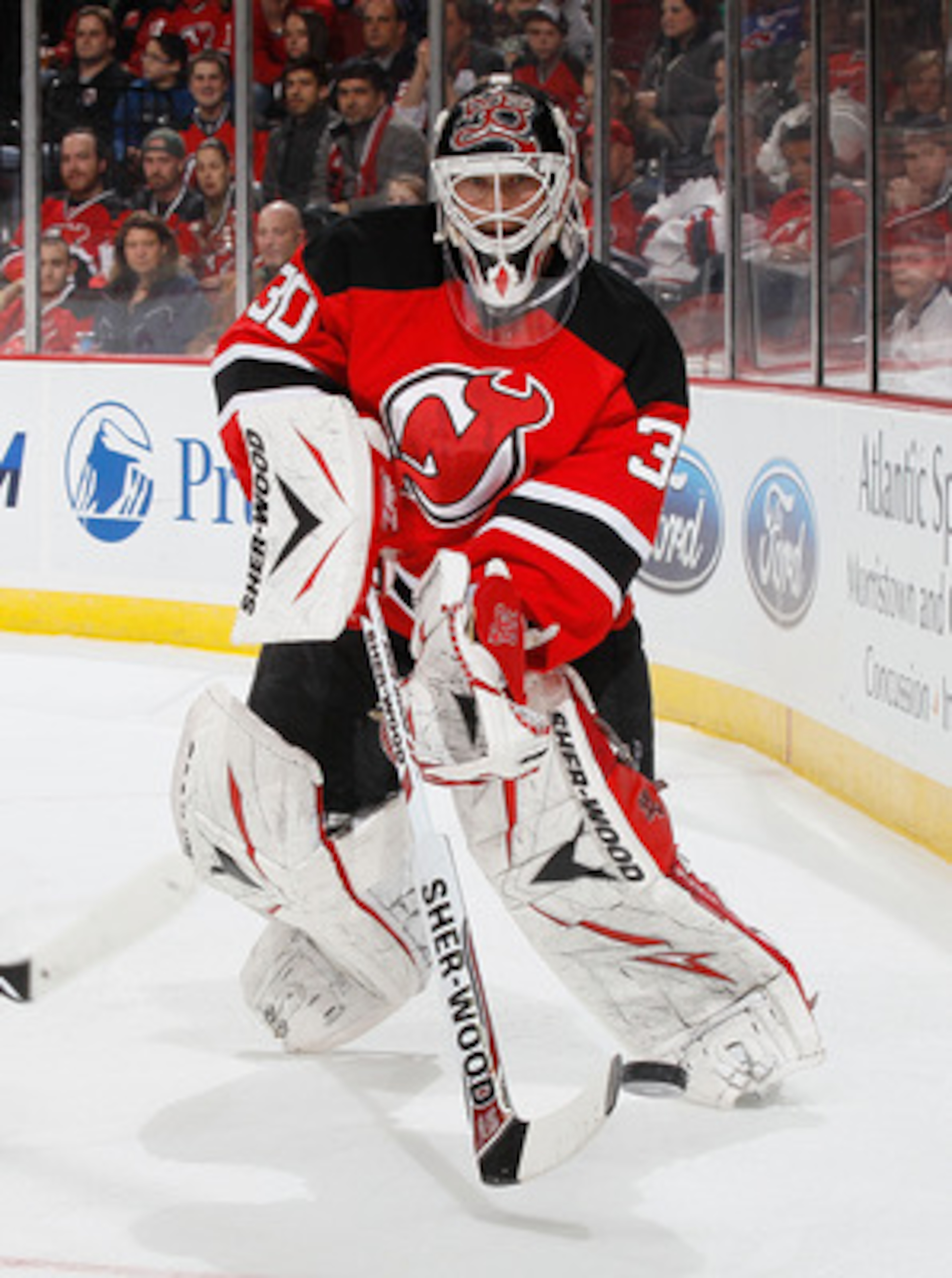 NEWARK, NJ - MARCH 12:  Goaltender Martin Brodeur #30 of the New Jersey Devils clears the puck behind the net against the New York Islanders on March 12, 2011 at the Prudential Center in Newark, New Jersey. Devisl defeated the Islanders 3-2 in OT. (Photo 