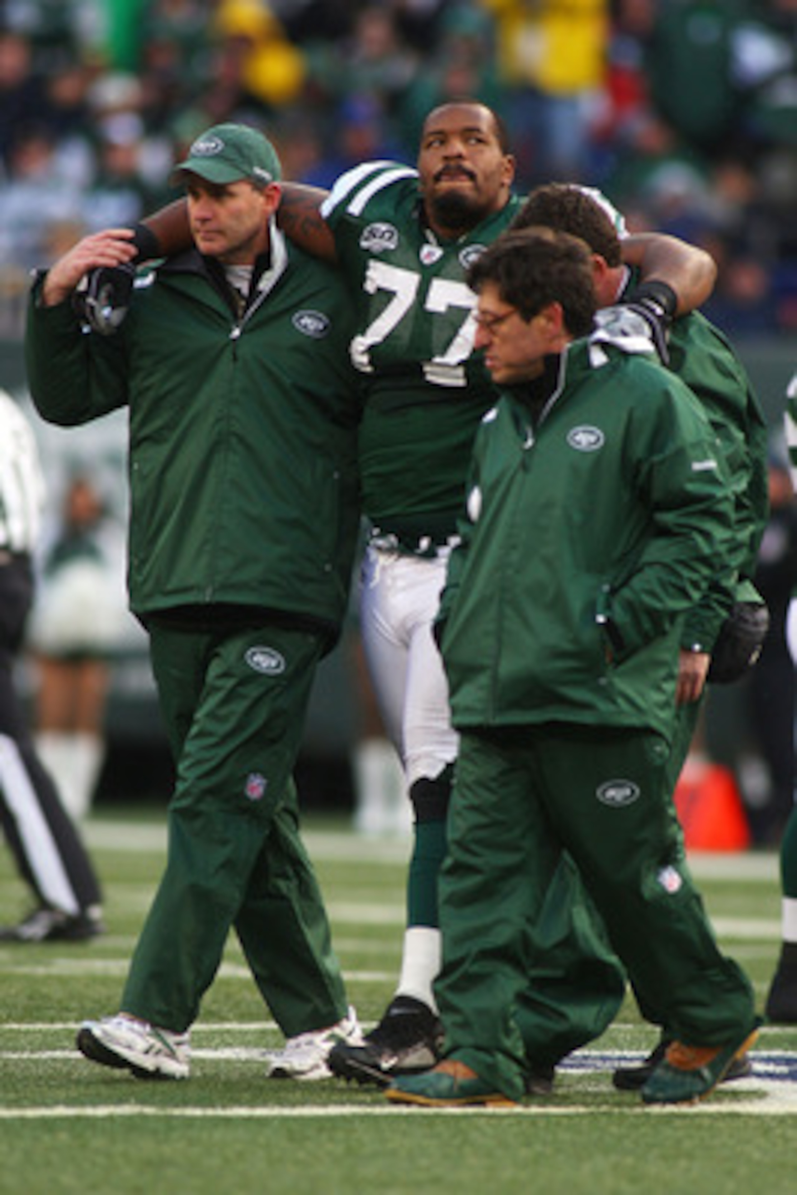 EAST RUTHERFORD, NJ - OCTOBER 18:  Kris Jenkins #77 of the New York Jets is helped off the field after being injured in the second quarter against the Buffalo Bills at Giants Stadium in the Meadowlands on October 18, 2009 in East Rutherford, New Jersey.