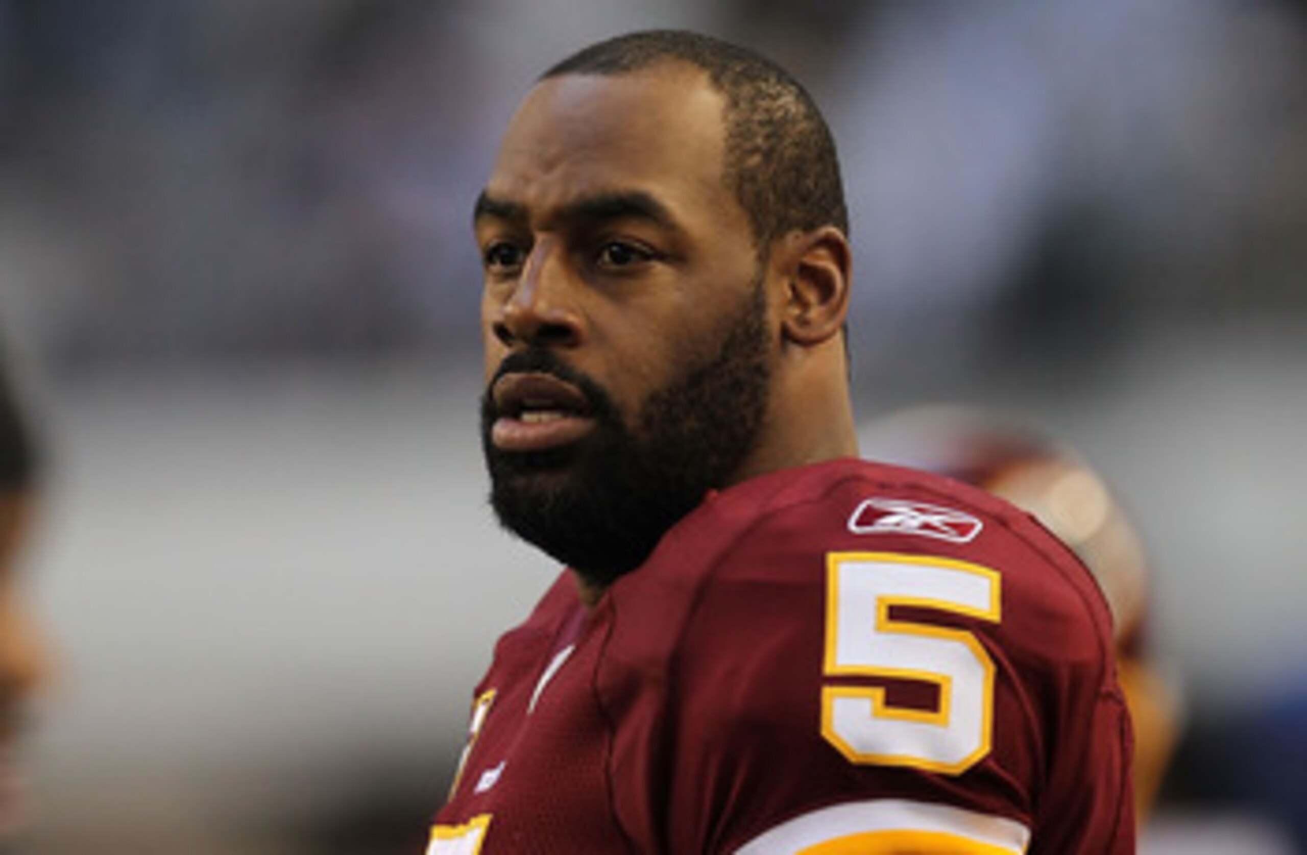 ARLINGTON, TX - DECEMBER 19:  Quarterback Donovan McNabb #5  of the Washington Redskins on the sidelines against play against the Dallas Cowboys at Cowboys Stadium on December 19, 2010 in Arlington, Texas.  (Photo by Ronald Martinez/Getty Images)