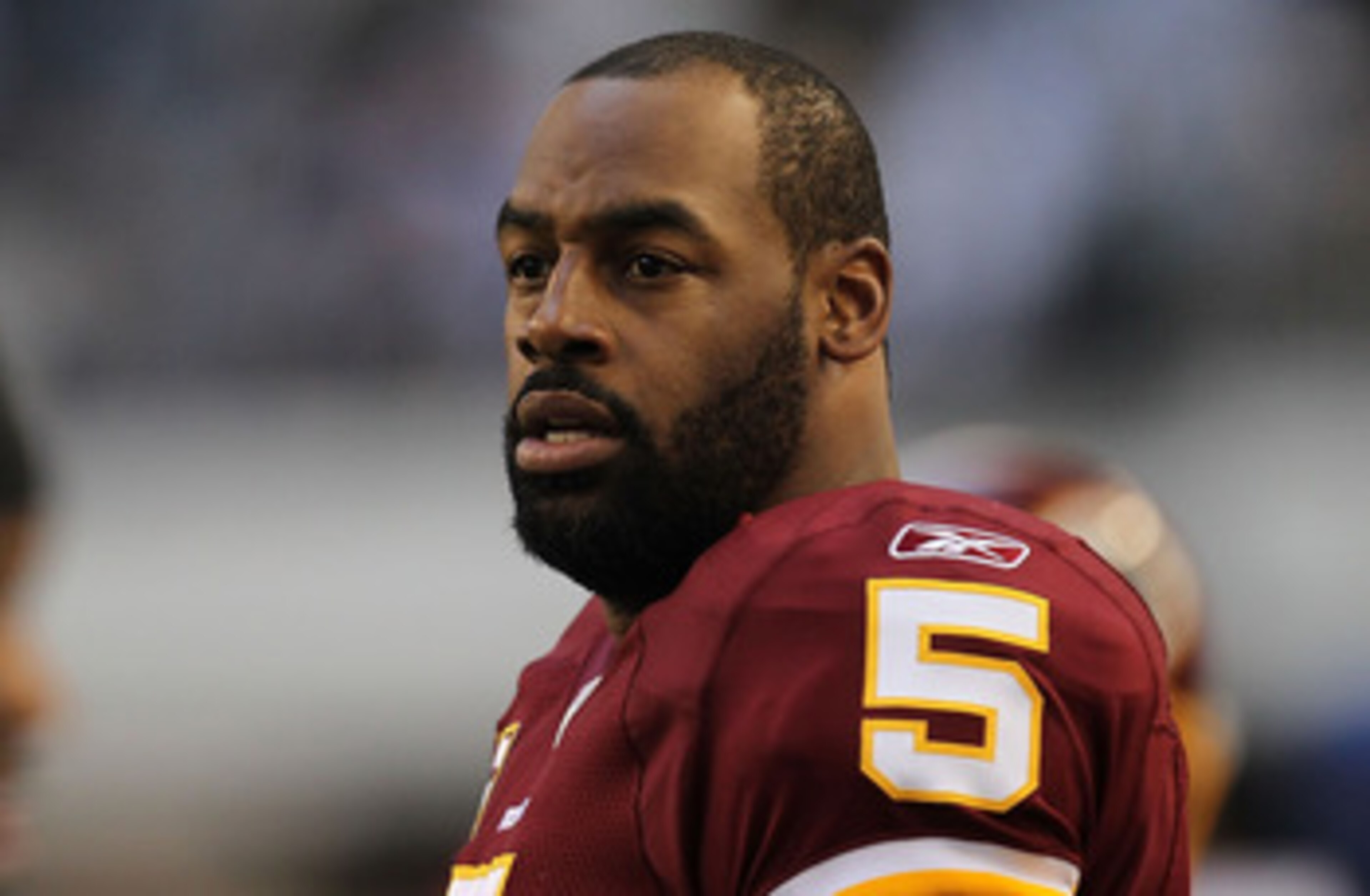 ARLINGTON, TX - DECEMBER 19:  Quarterback Donovan McNabb #5  of the Washington Redskins on the sidelines against play against the Dallas Cowboys at Cowboys Stadium on December 19, 2010 in Arlington, Texas.  (Photo by Ronald Martinez/Getty Images)