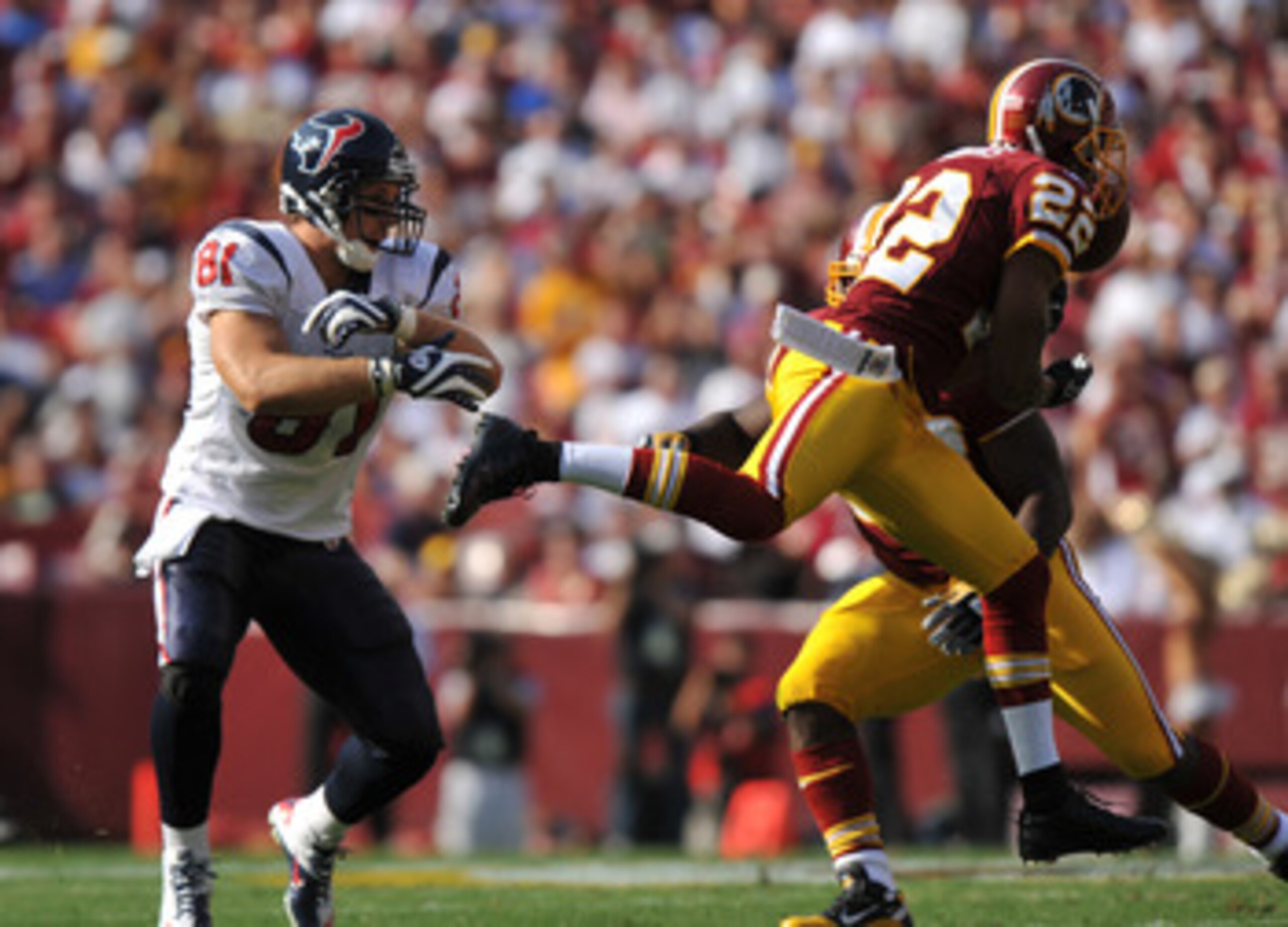 LANDOVER - SEPTEMBER 19:  Carlos Rogers #22 of the Washington Redskins makes an interception against the Houston Texans at FedExField on September 19, 2010 in Landover, Maryland. The Texans defeated the Redskins 30-27 in overtime. (Photo by Larry French/G