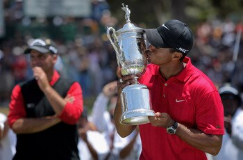 SAN DIEGO - JUNE 16:  Tiger Woods celebrates with the trophy after winning on the first sudden death playoff hole during the playoff round of the 108th U.S. Open at the Torrey Pines Golf Course (South Course) on June 16, 2008 in San Diego, California. Run