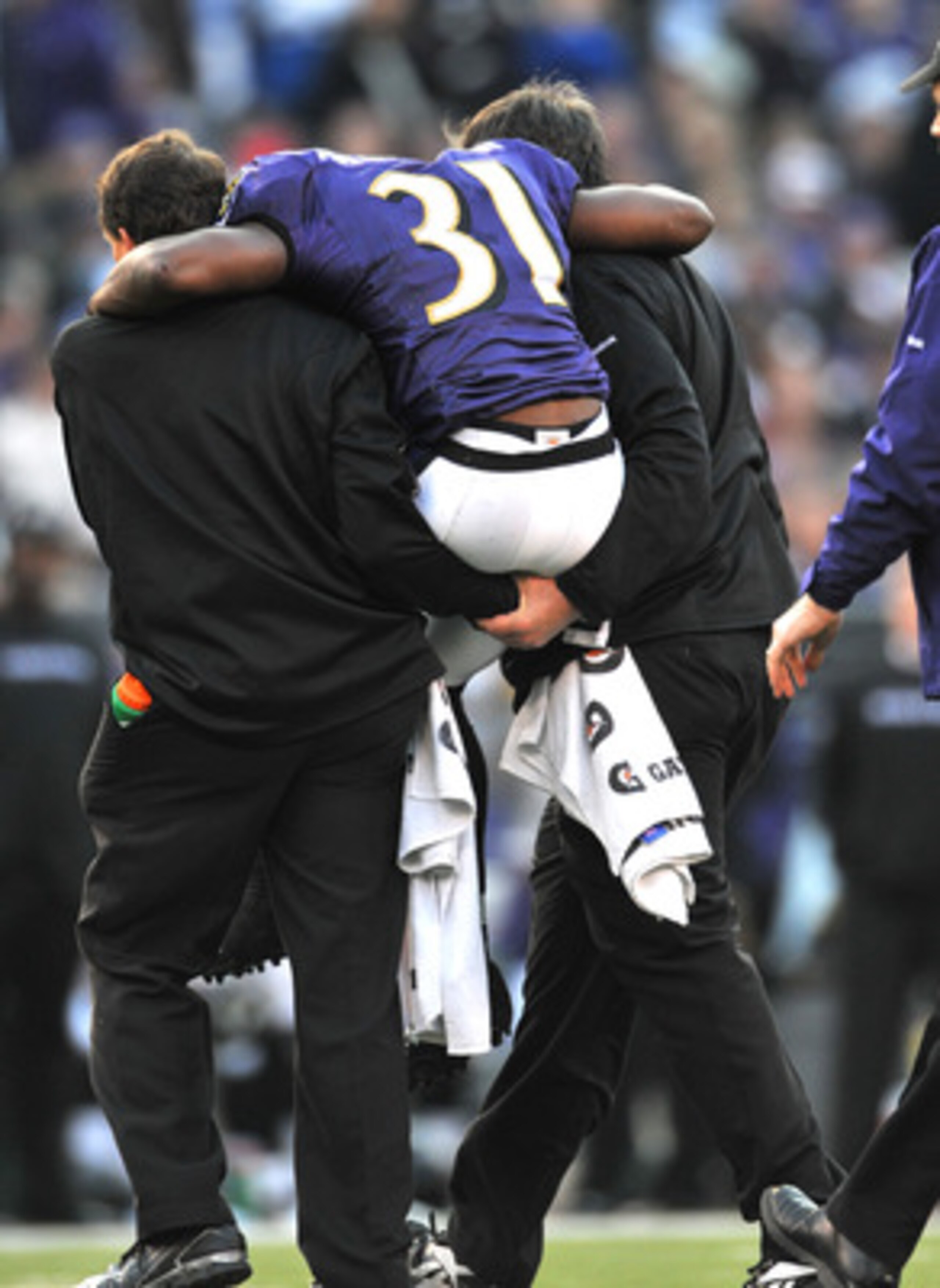 BALTIMORE - NOVEMBER 22:  Fabian Washington #31 of the Baltimore Ravens is carried off the field late in the game after an injury during the game against the Indianapolis Colts at M&T Bank Stadium on November 22, 2009 in Baltimore, Maryland. The Colts def