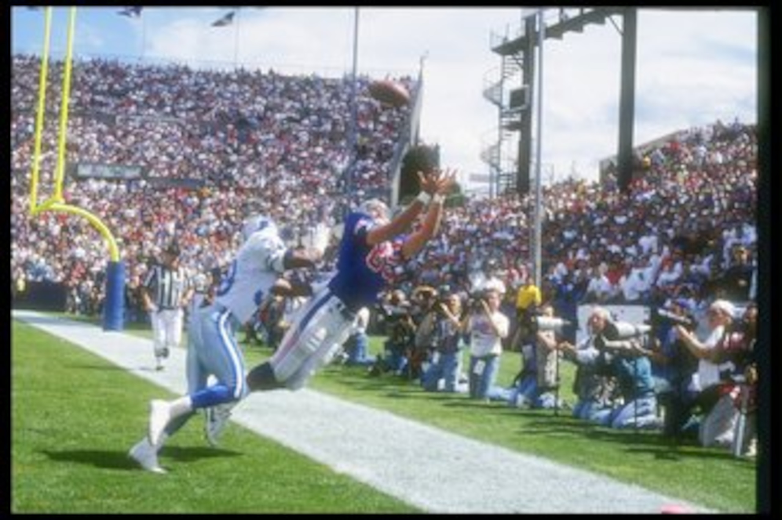 12 Sep 1993: Tight end Marv Cook of the New England Patriots attempts to make a sideline catch during a game against the Detroit Lions at Foxboro Stadium in Foxboro, Massachusetts. The Lions won the game in overtime, 19-16. Mandatory Credit: Rick Stewar 12 Sep 1993: Tight end Marv Cook of the New England Patriots attempts to make a sideline catch during a game against the Detroit Lions at Foxboro Stadium in Foxboro, Massachusetts. The Lions won the game in overtime, 19-16. Mandatory Credit: Rick Stewar