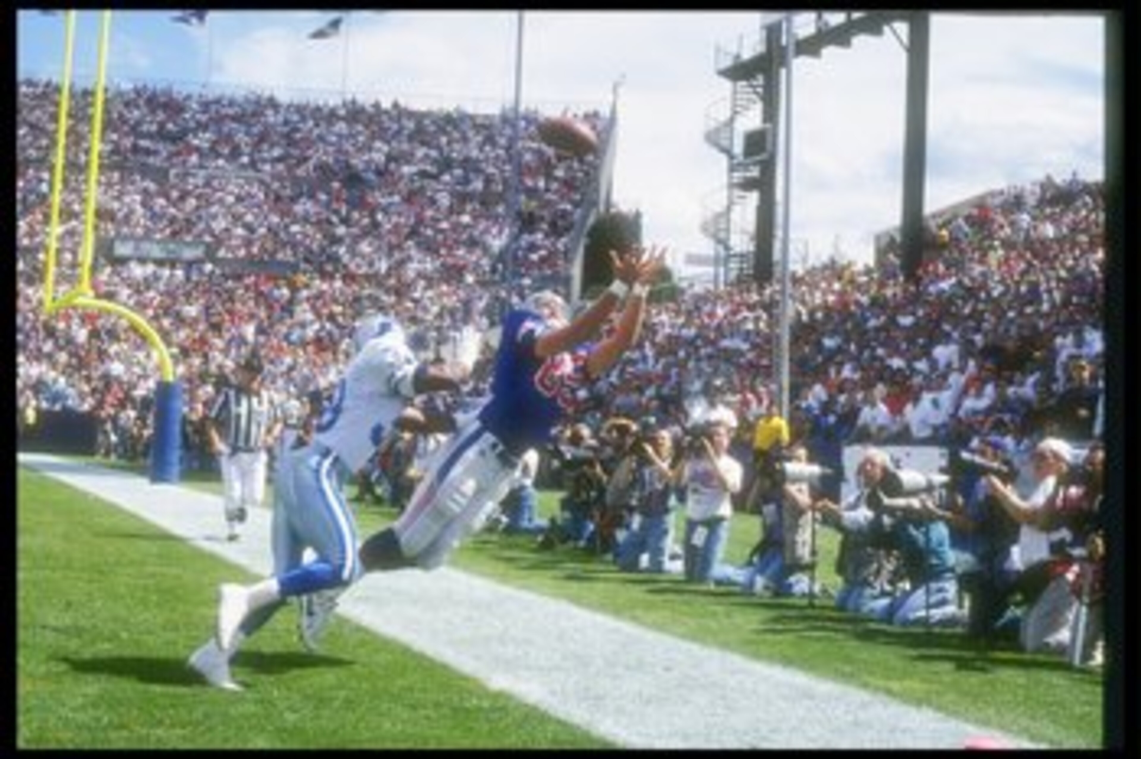 12 Sep 1993:  Tight end Marv Cook of the New England Patriots attempts to make a sideline catch during a game against the Detroit Lions at Foxboro Stadium in Foxboro, Massachusetts.  The Lions won the game in overtime, 19-16. Mandatory Credit: Rick Stewar