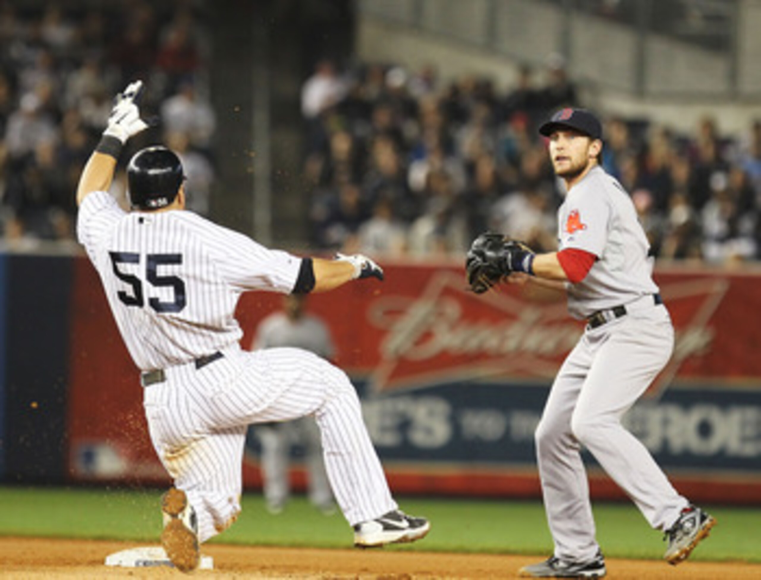 NEW YORK, NY - MAY 15:  Jed Lowrie #12 of the Boston Red Sox reaches to get the force out on Russell Martin #55 of the New York Yankees during their game on May 15, 2011 at Yankee Stadium in the Bronx borough of New York City.  (Photo by Al Bello/Getty Im