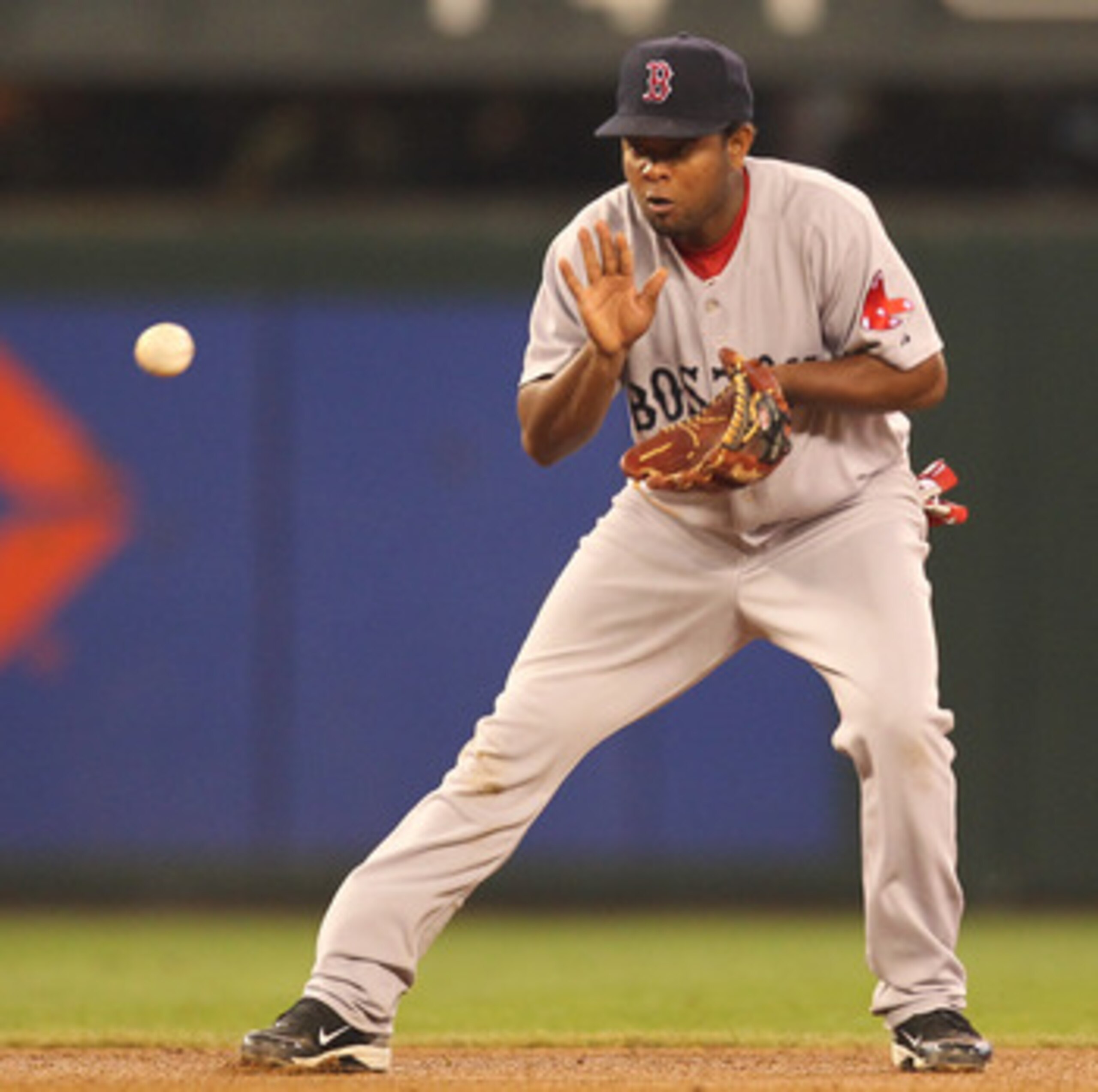 SEATTLE - SEPTEMBER 15:  Yamaico Navarro #56 of the Boston Red Sox fields a grounder against the Seattle Mariners at Safeco Field on September 15, 2010 in Seattle, Washington. (Photo by Otto Greule Jr/Getty Images)