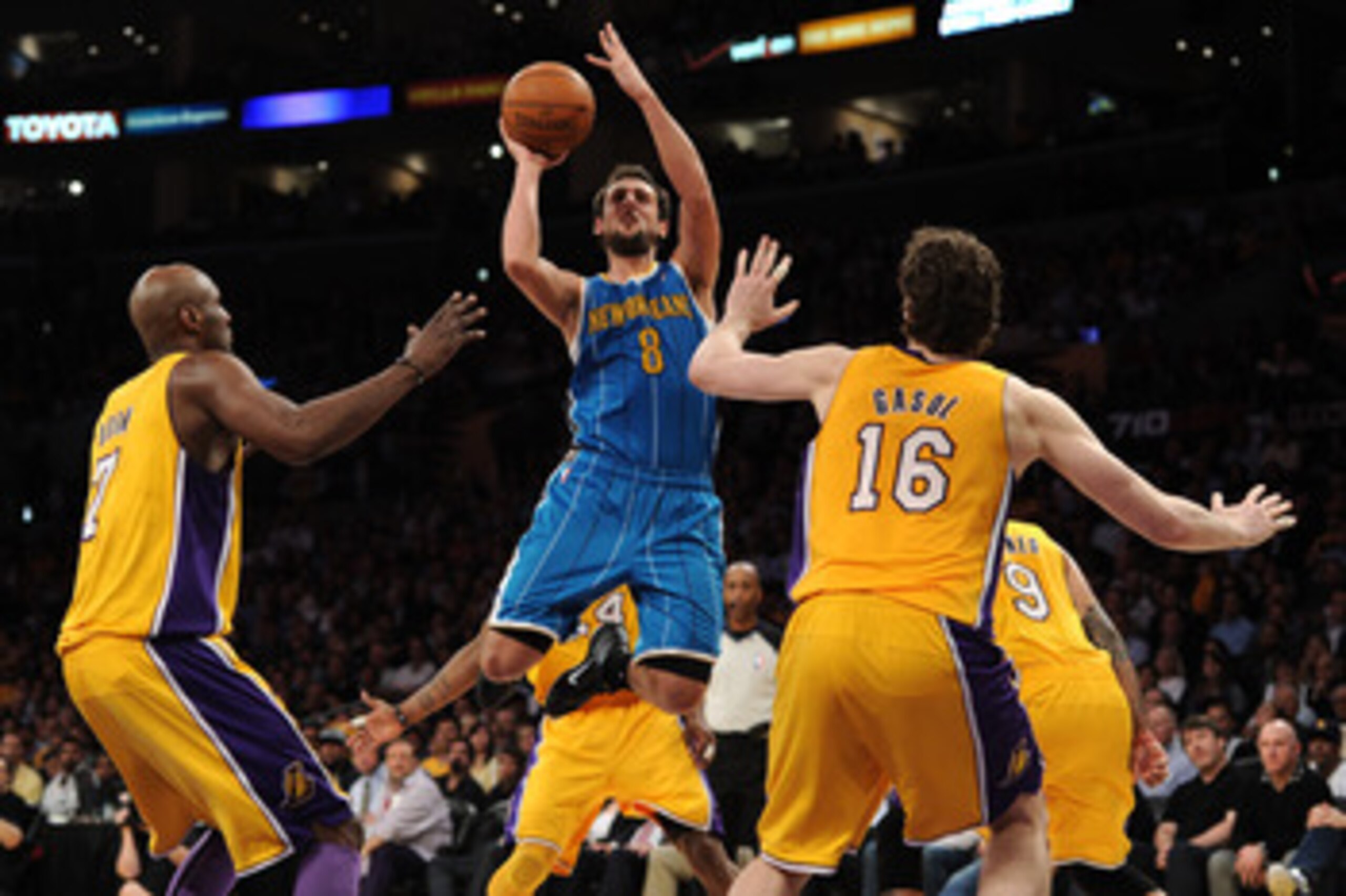 LOS ANGELES, CA - APRIL 26:  Marco Belinelli #8 of the New Orleans Hornets shoots over Lamar Odom #7 and Pau Gasol #16 of the Los Angeles Lakers in Game Five of the Western Conference Quarterfinals in the 2011 NBA Playoffs on April 26, 2011 at Staples Cen