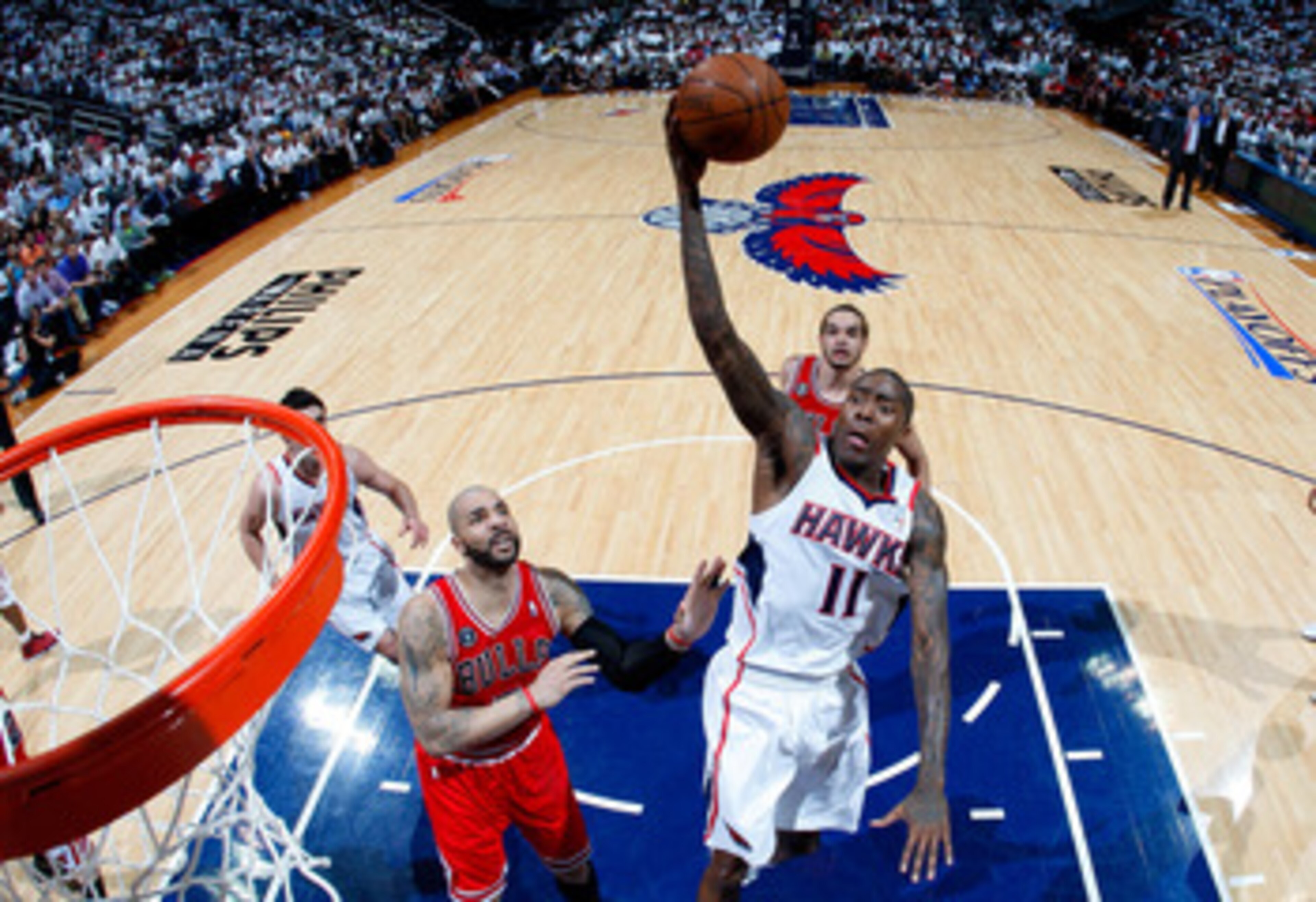 ATLANTA, GA - MAY 12:  Jamal Crawford #11 of the Atlanta Hawks drives the basket against Carlos Boozer #5 of the Chicago Bulls in Game Six of the Eastern Conference Semifinals in the 2011 NBA Playoffs at Phillips Arena on May 12, 2011 in Atlanta, Georgia.