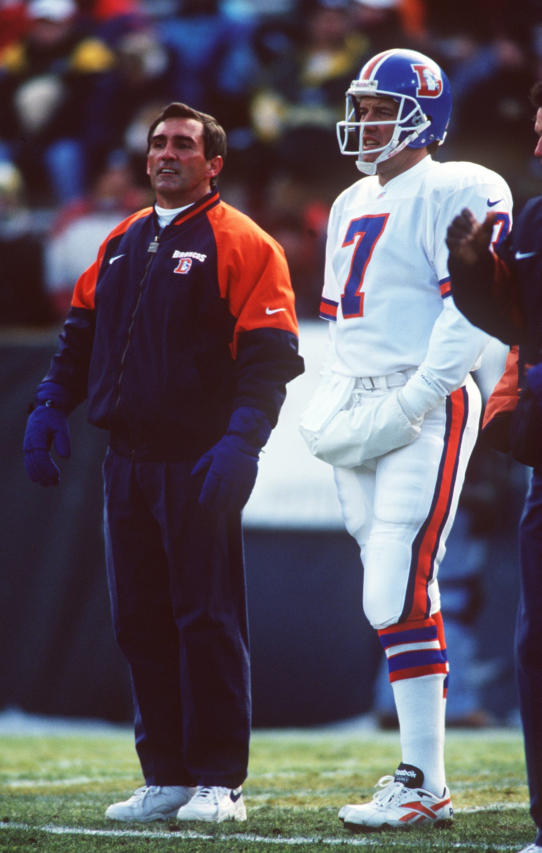 8 Dec 1996: Head coach Mike Shanahan (left) and Quarterback John Elway of the Denver Broncos stand on the sidelines during the Broncos 41-6 loss to the Green Bay Packers at Lambeau Field in Green Bay, Wisconsin.