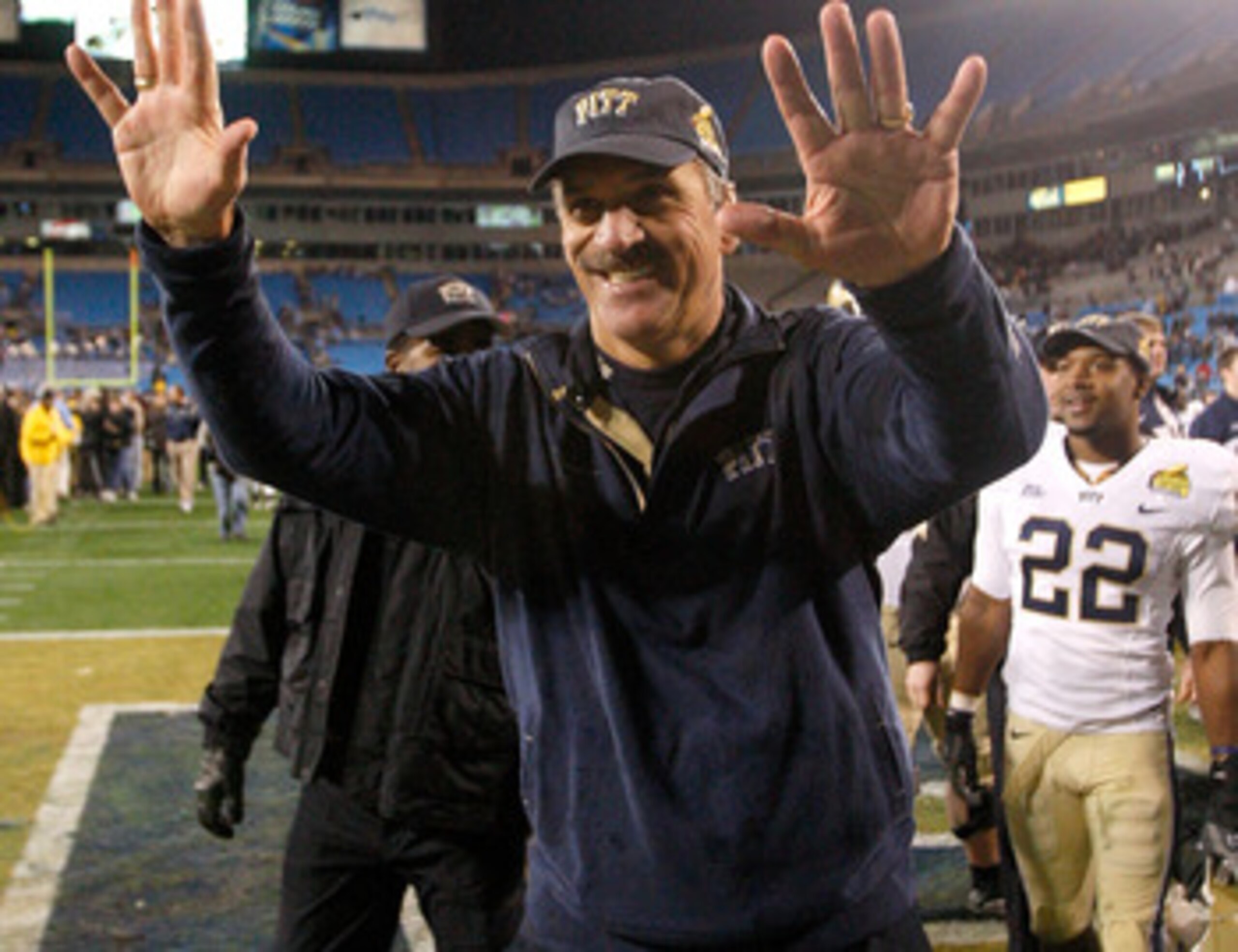 CHARLOTTE, NC - DECEMBER 26:  Head coach Dave Wannstedt of the Pittsburgh Panthers waves to the fans after a 19-17 victory over the North Carolina Tar Heels on December 26, 2009 in Charlotte, North Carolina.  (Photo by Streeter Lecka/Getty Images)