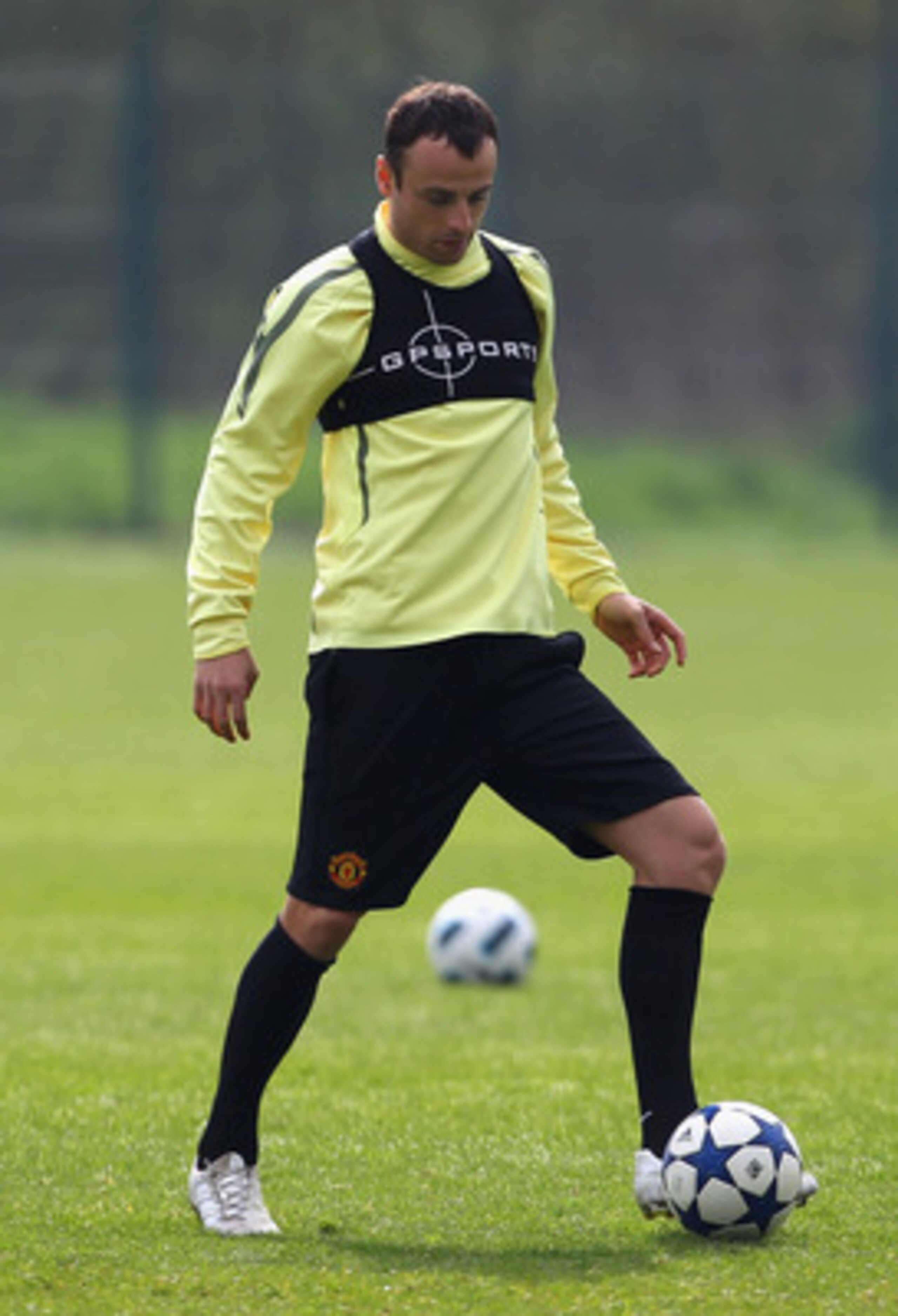 MANCHESTER, ENGLAND - APRIL 11:  Dimitar Berbatov of Manchester United controls the ball during a training session ahead of their UEFA Champions League quarter final second leg match against Chelsea at the Carrington Training Complex on April 11, 2011 in