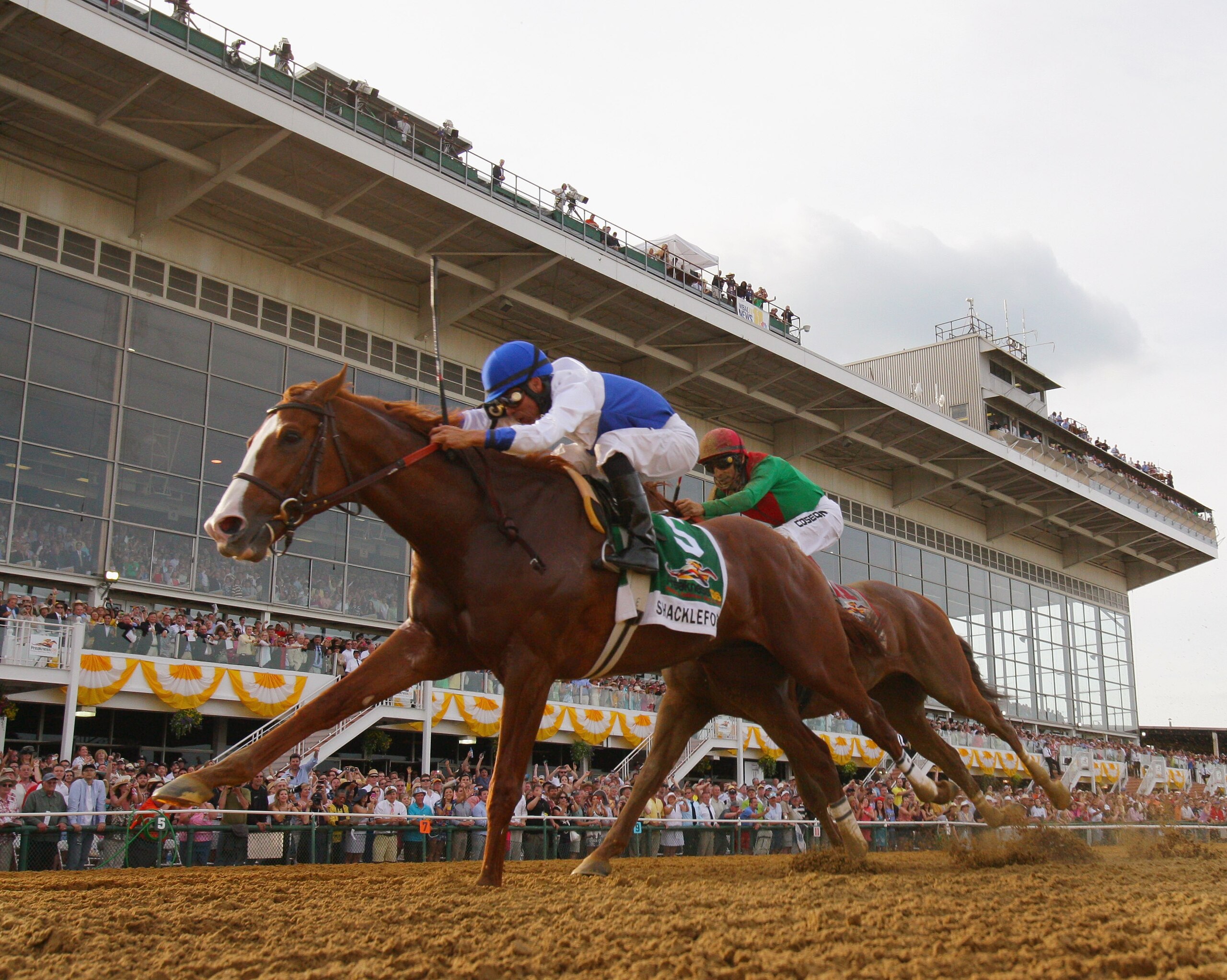 BALTIMORE, MD - MAY 21: Jockey Jesus Castanon guides Shackleford #5 (C) to victory over Animal Kingdom and jocky John Velazquez #11 to win the 136th running of the Preakness Stakes at Pimlico Race Course on May 21, 2011 in Baltimore, Maryland. (Photo by BALTIMORE, MD - MAY 21: Jockey Jesus Castanon guides Shackleford #5 (C) to victory over Animal Kingdom and jocky John Velazquez #11 to win the 136th running of the Preakness Stakes at Pimlico Race Course on May 21, 2011 in Baltimore, Maryland. (Photo by
