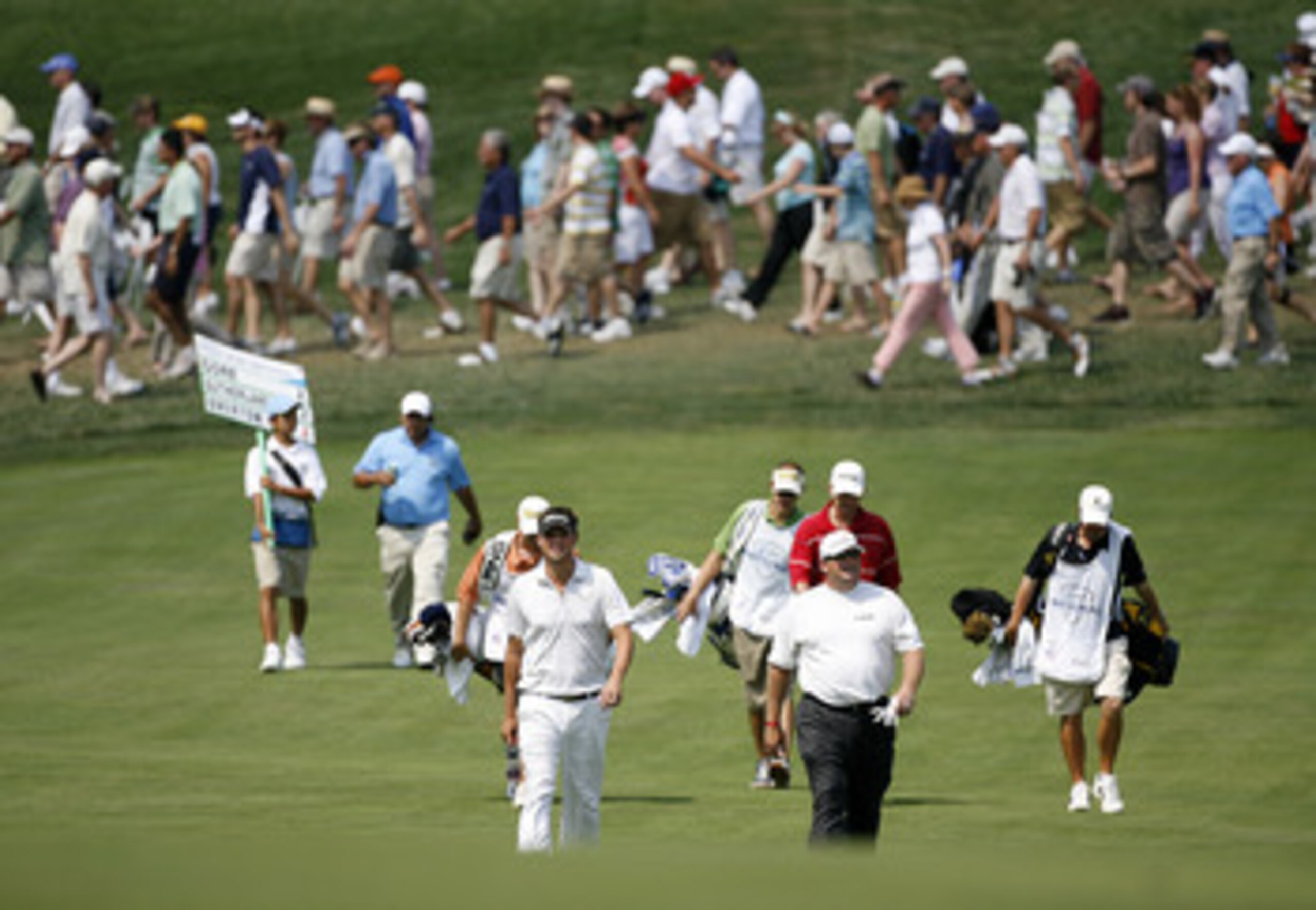 BETHESDA, MD - JULY 3: (L-R) Jeff Overton and Jeff Gore walk toward their balls on the 5th hole during the first round of the AT&T National at Congressional Country Club on July 3, 2008 in Bethesda, Maryland. (Photo by Hunter Martin/Getty Images)