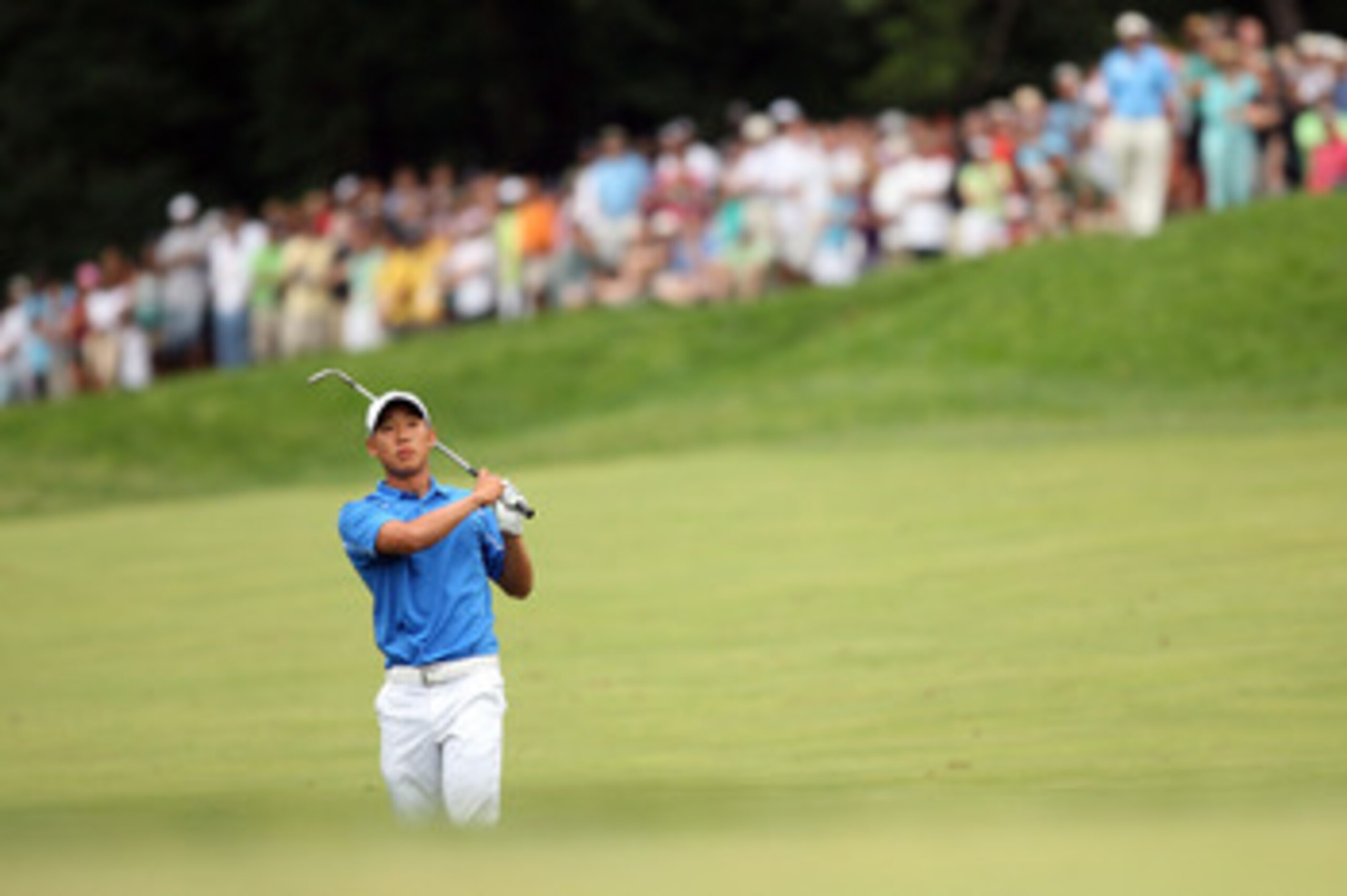 BETHESDA, MD - JULY 05:  Anthony Kim watches his shot during the final round of the AT&T National hosted by Tiger Woods at Congressional Country Club on July 5, 2009 in Bethesda, Maryland.  (Photo by Hunter Martin/Getty Images)