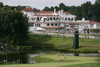 BETHESDA, MD - JULY 4 : The group of Anthony Kim and Jim Furyk putt out on the 18th hole during the third round of the AT&T National hosted by Tiger Woods at Congressional Country Club on July 4, 2009 in Bethesda, Maryland. (Photo by Hunter Martin/Getty I