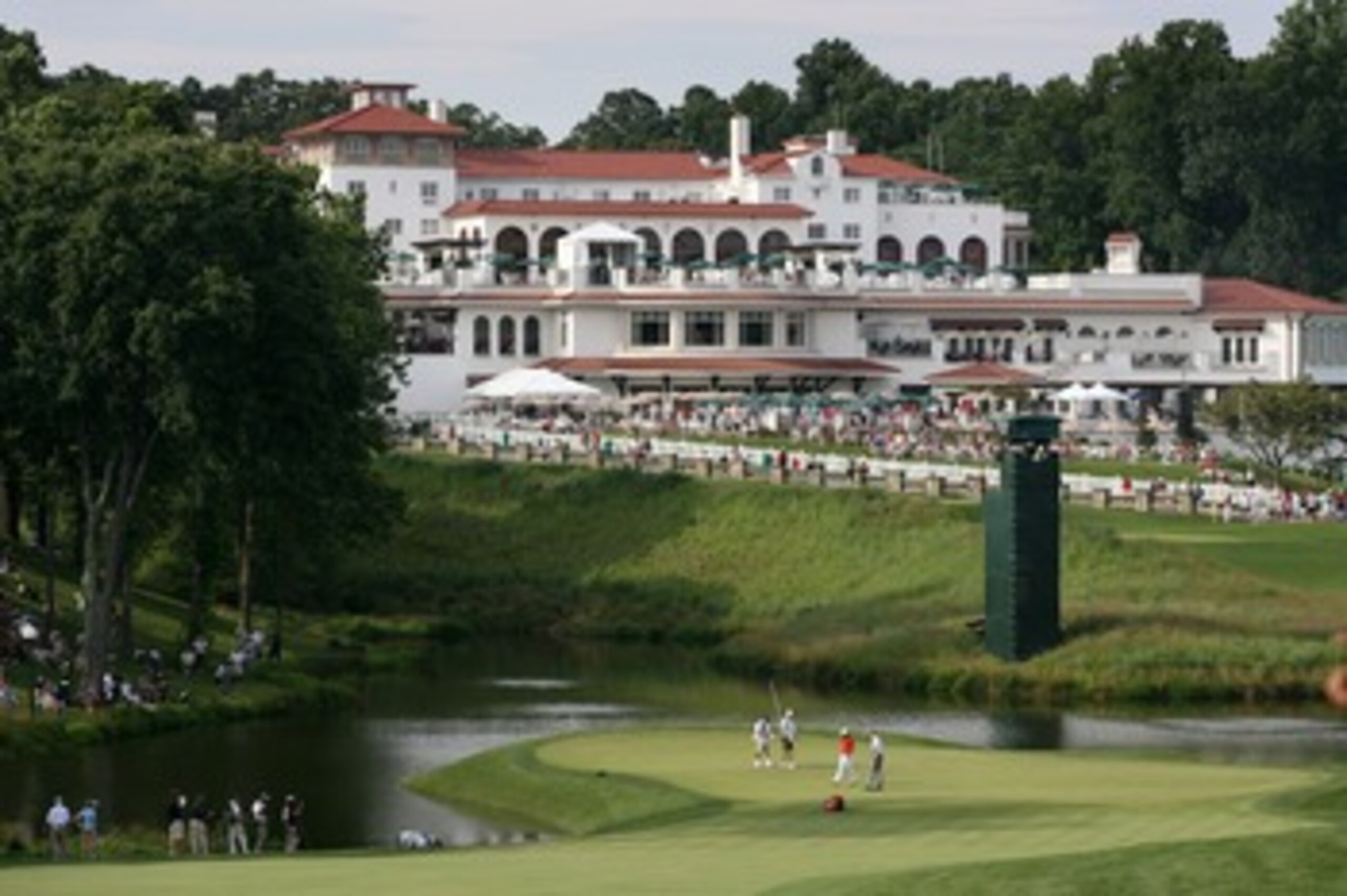 BETHESDA, MD - JULY 4 : The group of Anthony Kim and Jim Furyk putt out on the 18th hole during the third round of the AT&T National hosted by Tiger Woods at Congressional Country Club on July 4, 2009 in Bethesda, Maryland. (Photo by Hunter Martin/Getty I