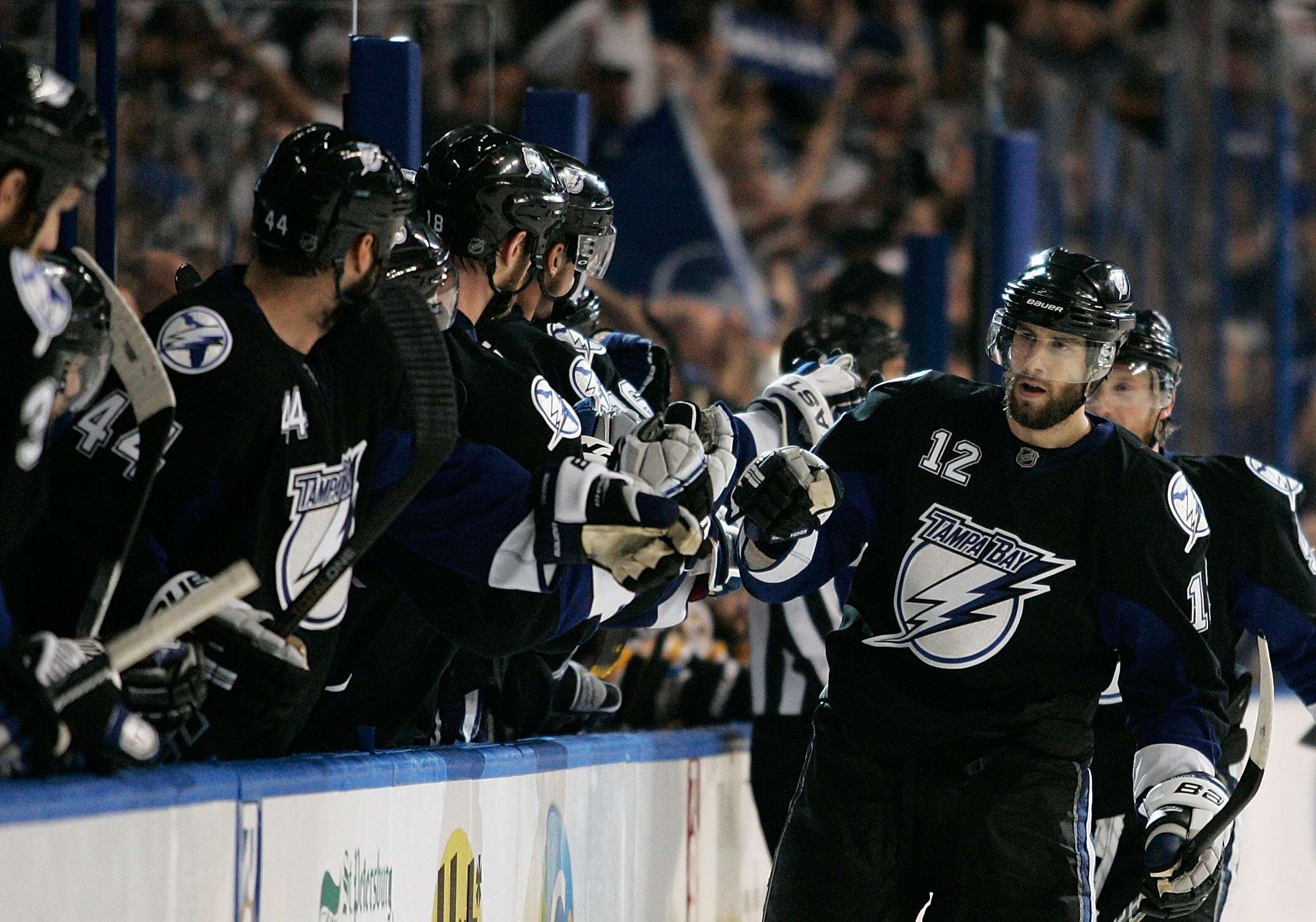 TAMPA, FL - MAY 21:  Simon Gagne #12 of the Tampa Bay Lightning celebrates with teammates in Game Four of the Eastern Conference Finals against the Boston Bruins during the 2011 NHL Stanley Cup Playoffs at St Pete Times Forum on May 21, 2011 in Tampa, Flo