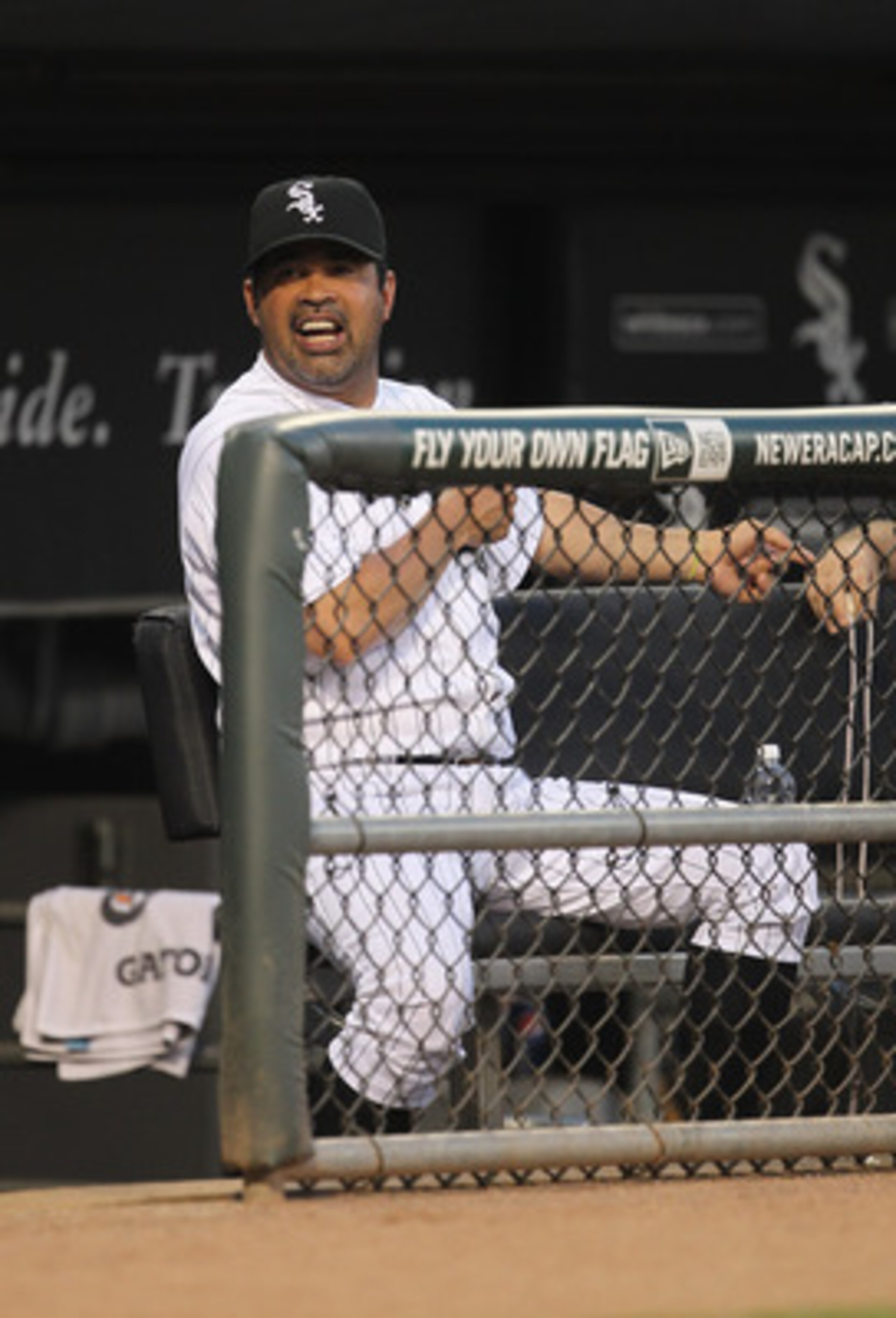 CHICAGO, IL - JUNE 08: Manager Ozzie Guillen #13 of the Chicago White Sox talks to a coach during a game against the Seattle Mariners at U.S. Cellular Field on June 8, 2011 in Chicago, Illinois. (Photo by Jonathan Daniel/Getty Images)