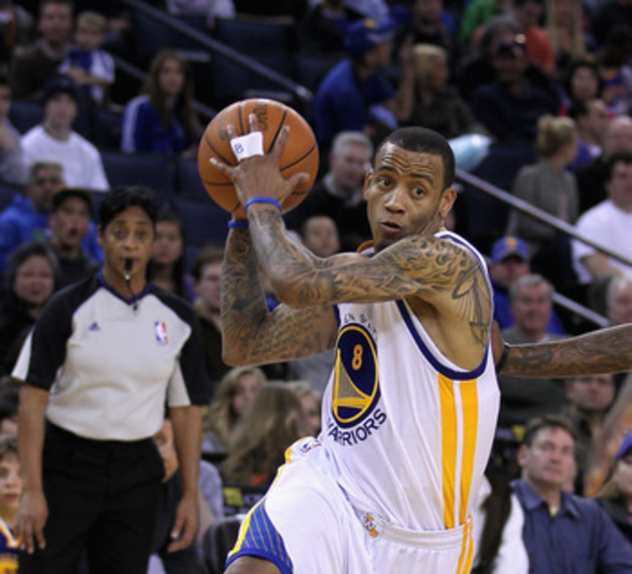OAKLAND, CA - MARCH 25: Monta Ellis #8 of the Golden State Warriors drives to the basket against the Toronto Raptors at Oracle Arena on March 25, 2011 in Oakland, California. NOTE TO USER: User expressly acknowledges and agrees that, by downloading and or