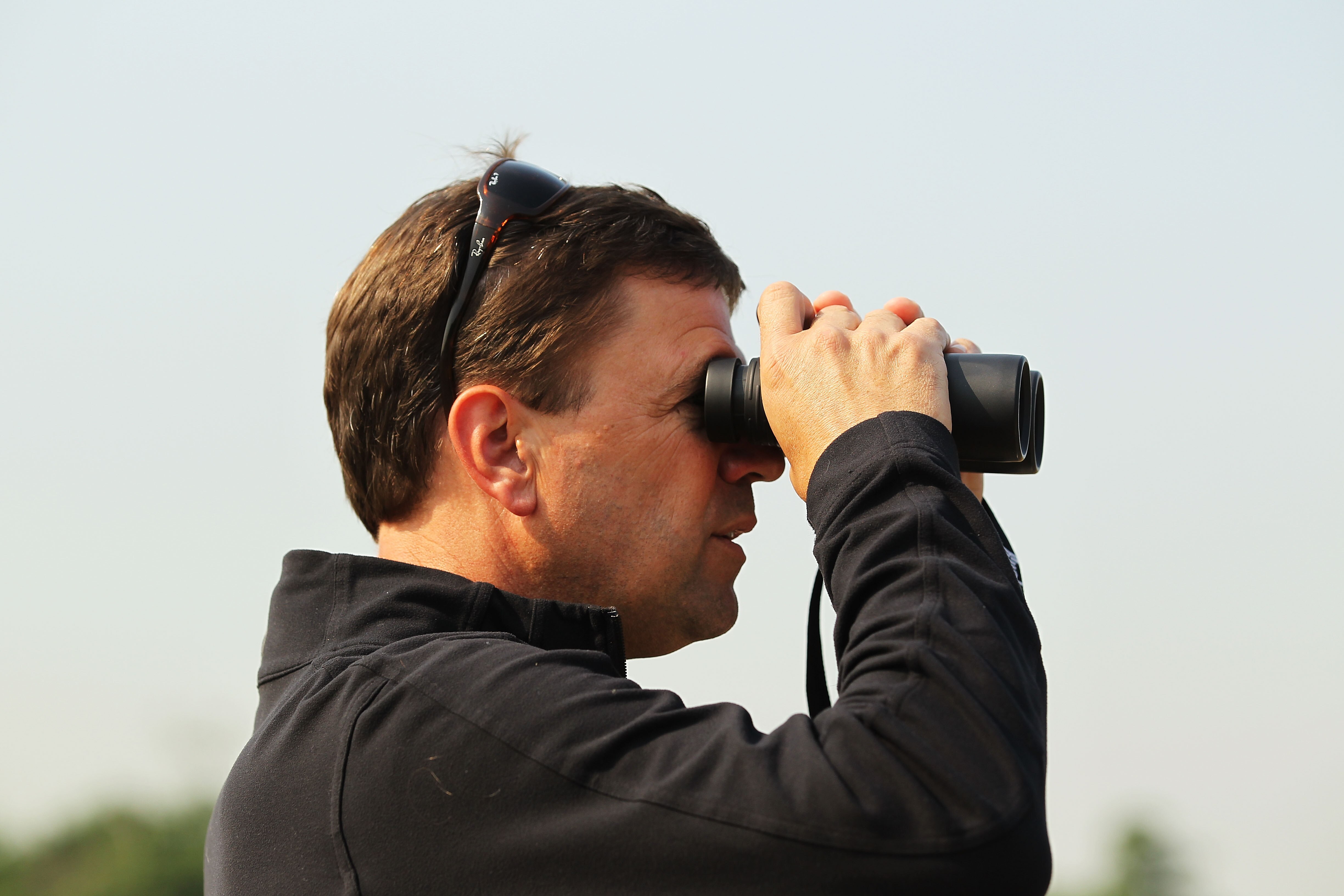 ELMONT, NY - JUNE 08:  Graham Motion, trainer of Animal Kingdom, watches the morning training session in preparation for The Belmont Stakes at Belmont Park on June 8, 2011 in Elmont, New York.  (Photo by Al Bello/Getty Images)